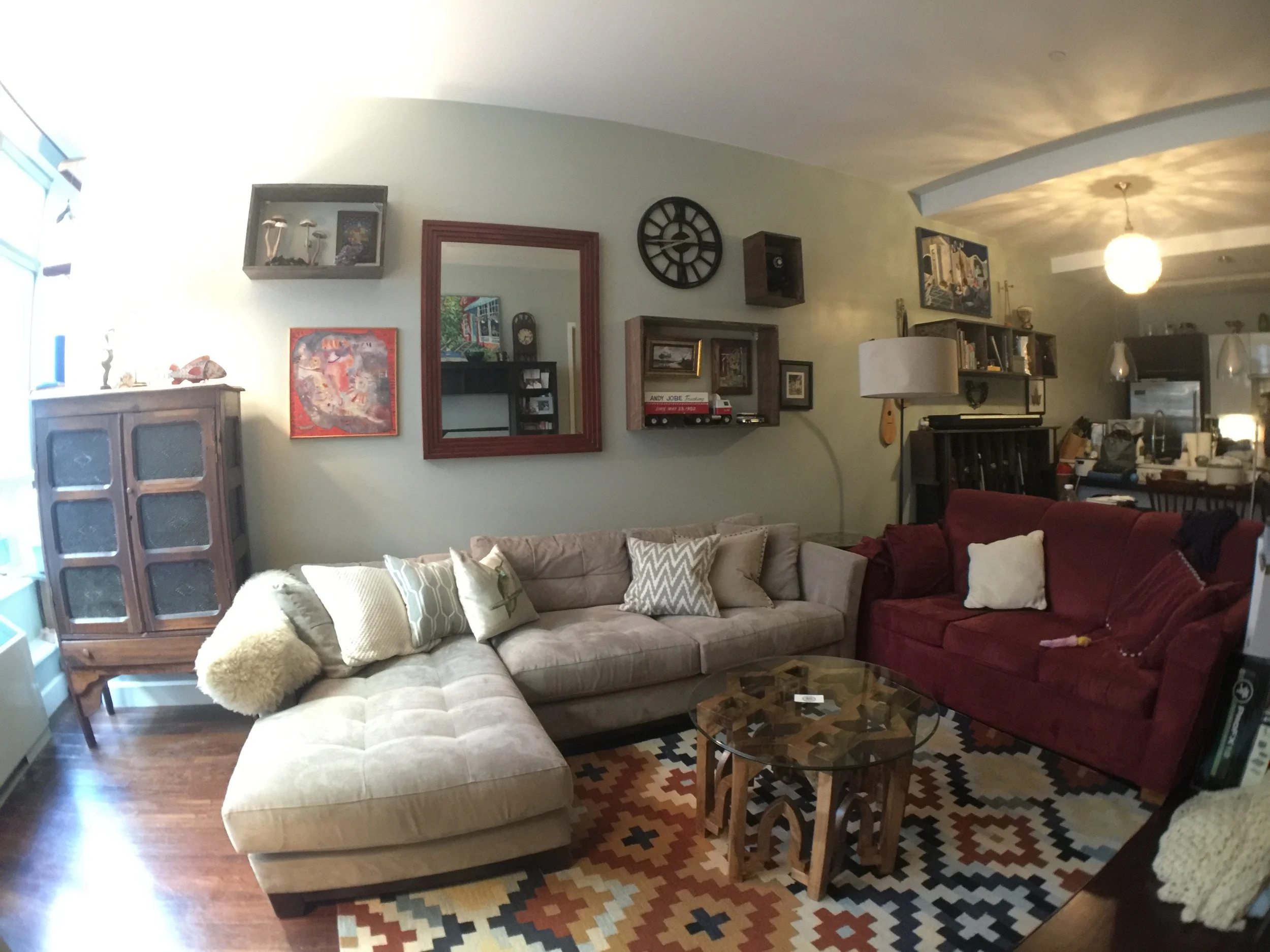 Shadow box shelving was added to this gallery wall to display the clients most prized possessions. Below is a video of us putting it together. Mixing the shelves and art created a fun eclectic look while using the height of the ceilings to their fullest potential.