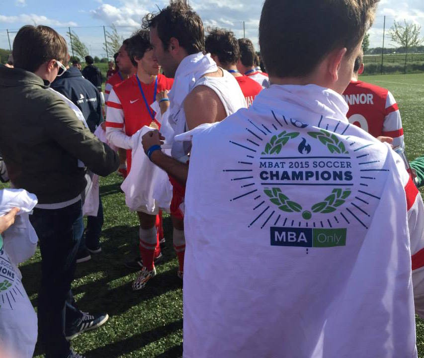 #30. Distributing medals and champ shirts to the men's winning football team, LBS. (via MBA Only )