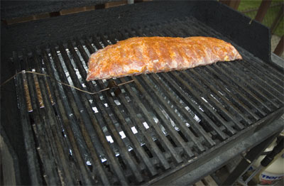 Picture taken from Amazing Ribs, notice the water pan underneath the rack and grates. This keeps the atmosphere in the grill moist.