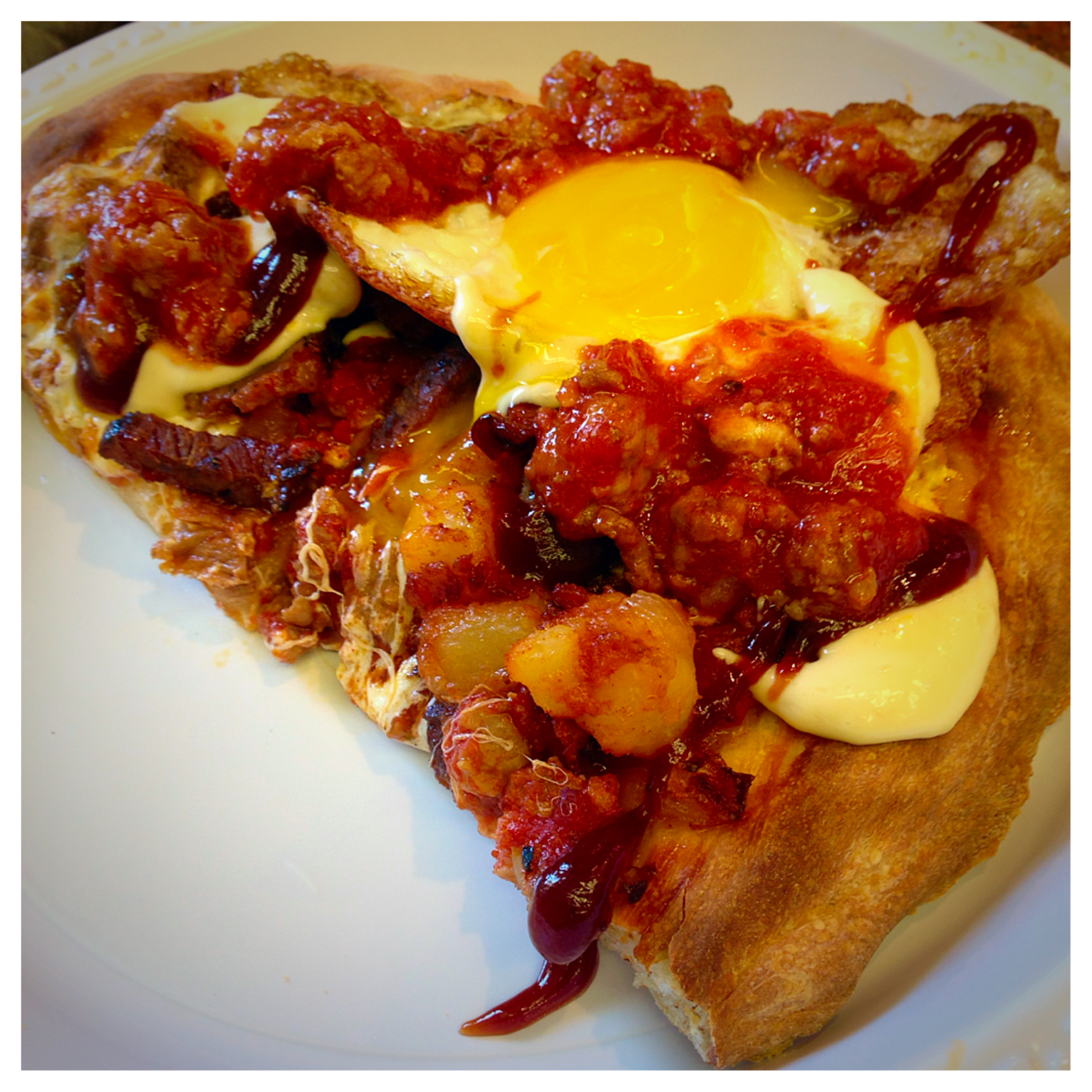 The pizza combines the barbecue of Texas , the pork roll of New Jersey , the "garbage plate" of Rochester and the pizza of New York !