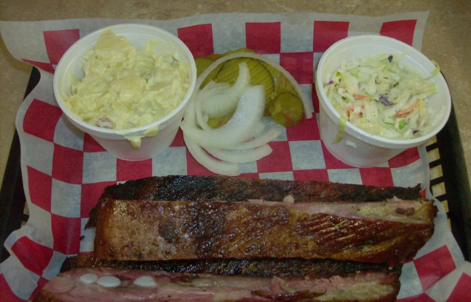 Bar-B- Que Plate (one meat: Ribs) with potato salad and coleslaw