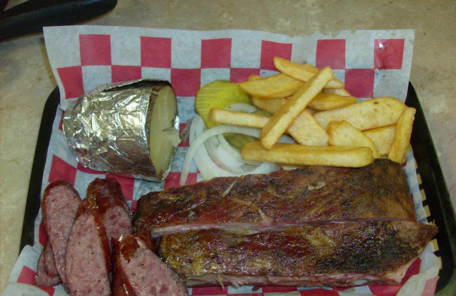 Bar-B-Que Plate (two meat: Ribs, sausage) with fries and baked potato