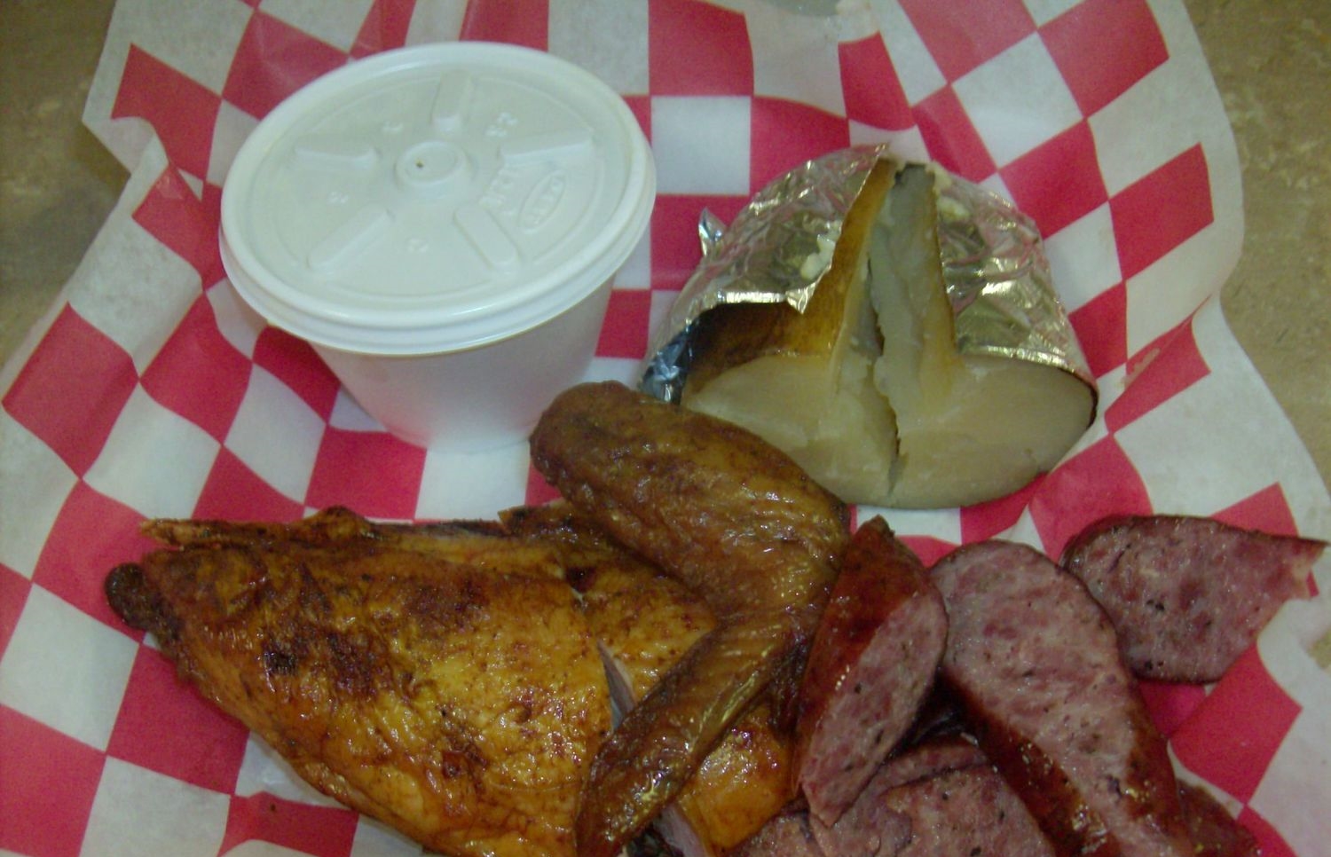 Bar-B-Que Plate (two meat: Half Chicken and Sausage) with Coleslaw and baked potato