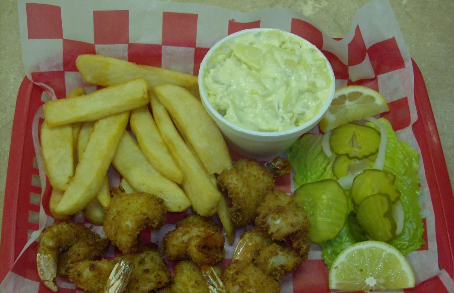 Shrimp plate with a side of Fries and potato salad