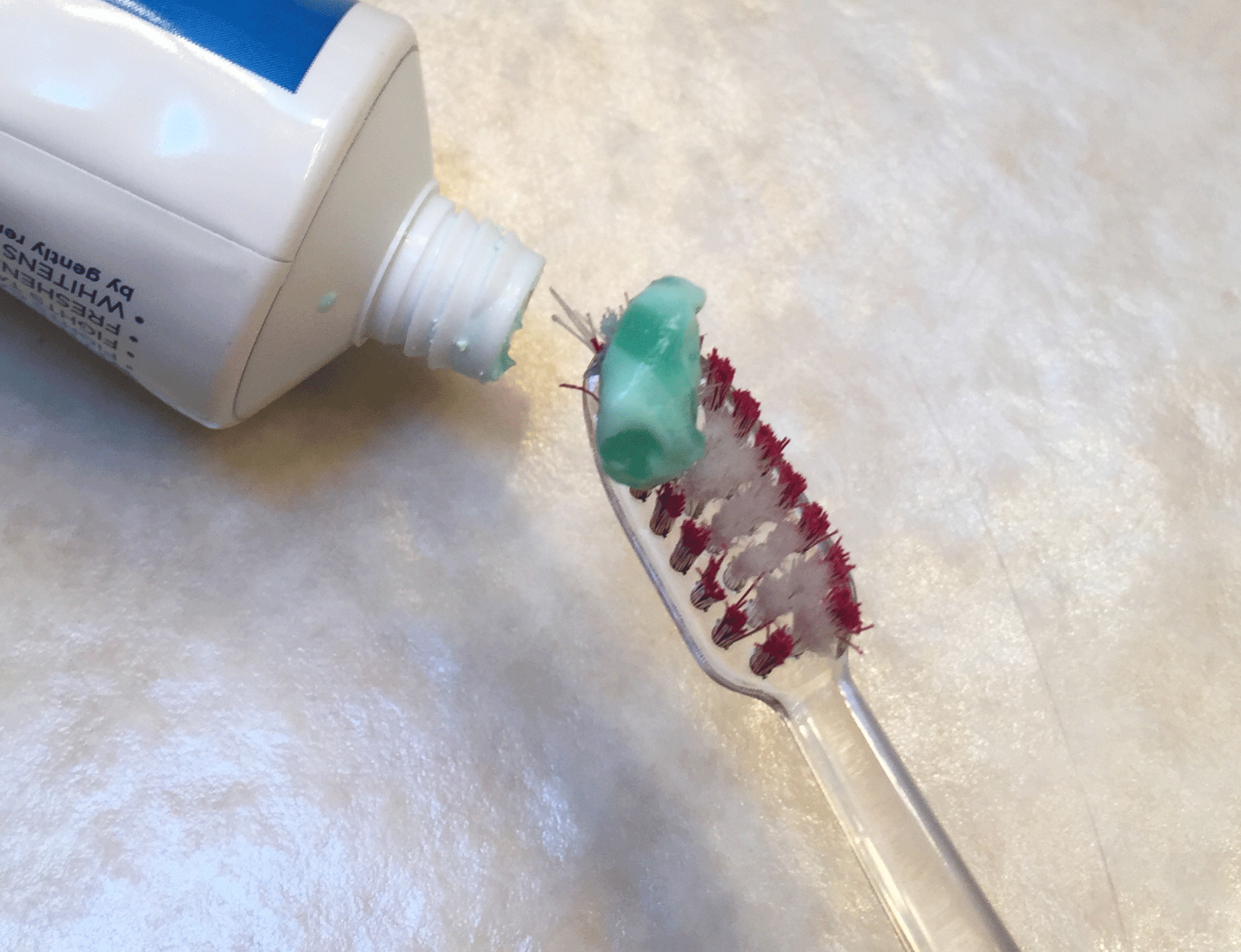 Use as basic a toothpaste as possible, without abrasive additives, and a soft bristled brush.
