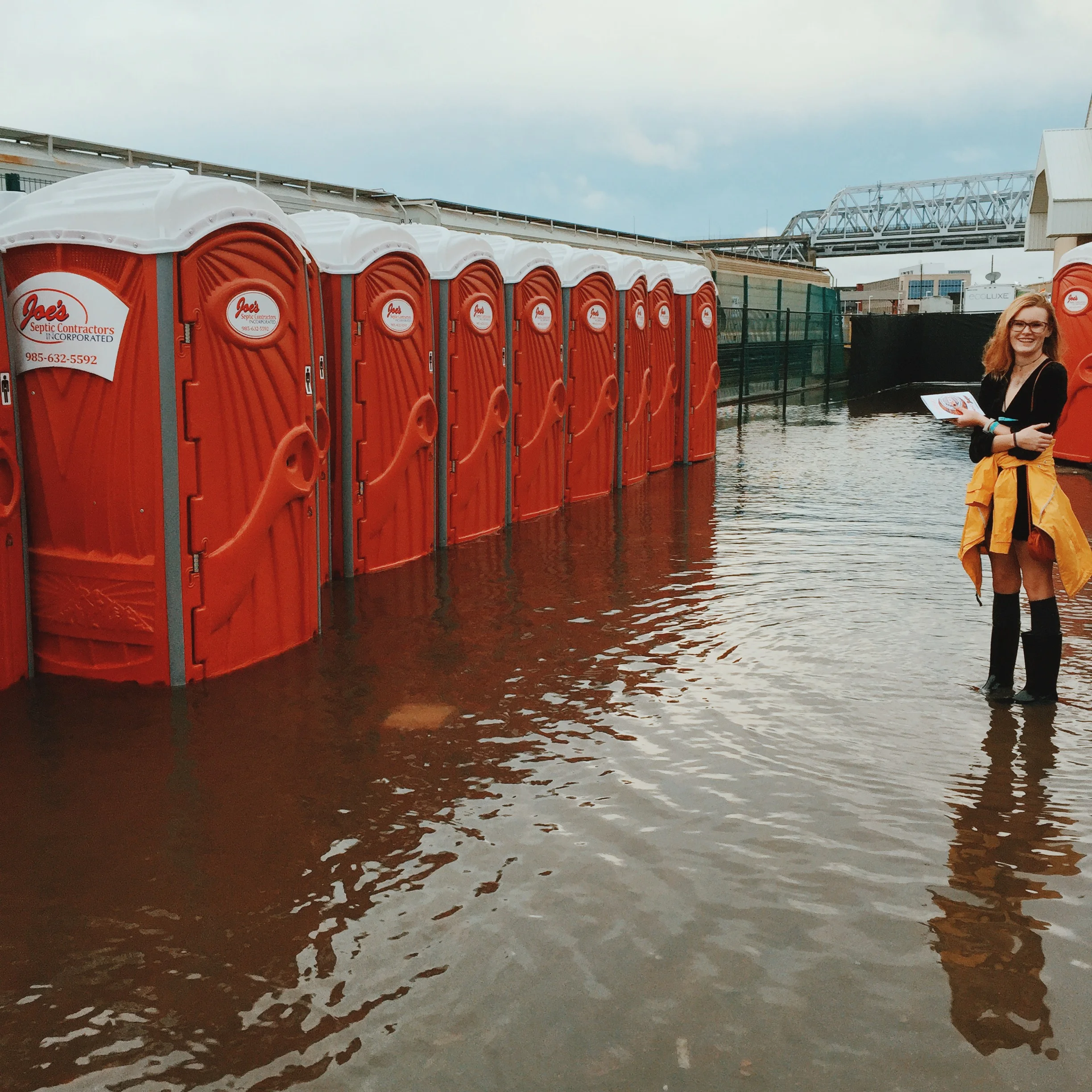 My friend Darby waiting to use a bathroom. New Orleans was pretty flooded from all the rain. This was real nasty.