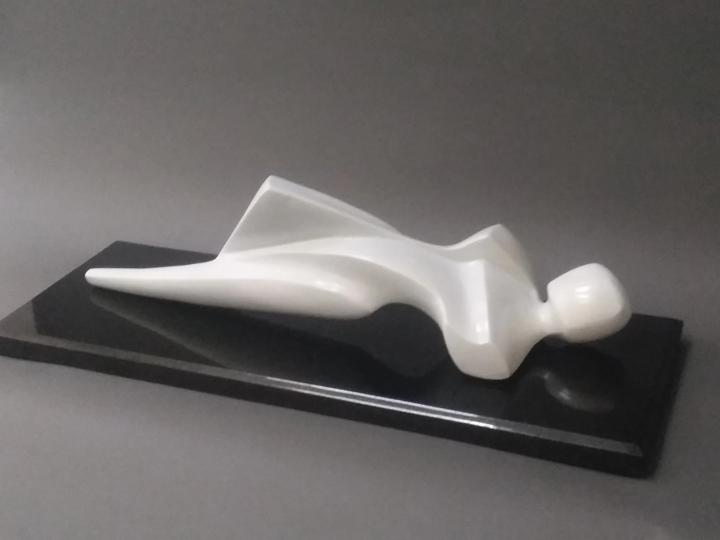 "Sunbather" 6.75"x25"x7" bronze sculpture with white patina on black marble base, 2/15 limited edition.
