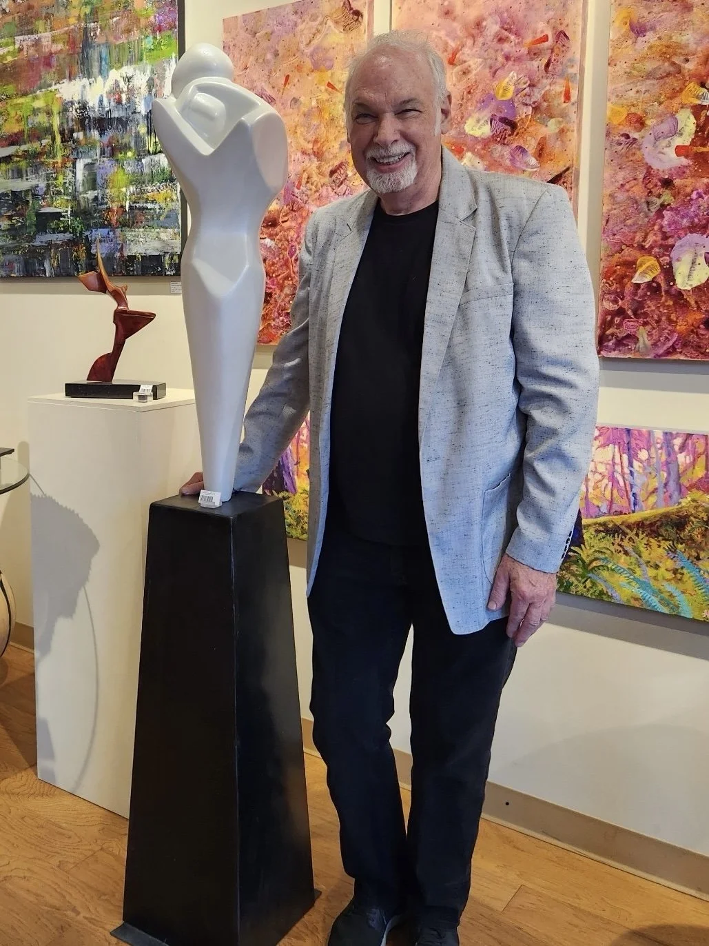 Reno Carollo with "Tight" 72"x12"x14" PETG sculpture with pearl mist finish, steel base.