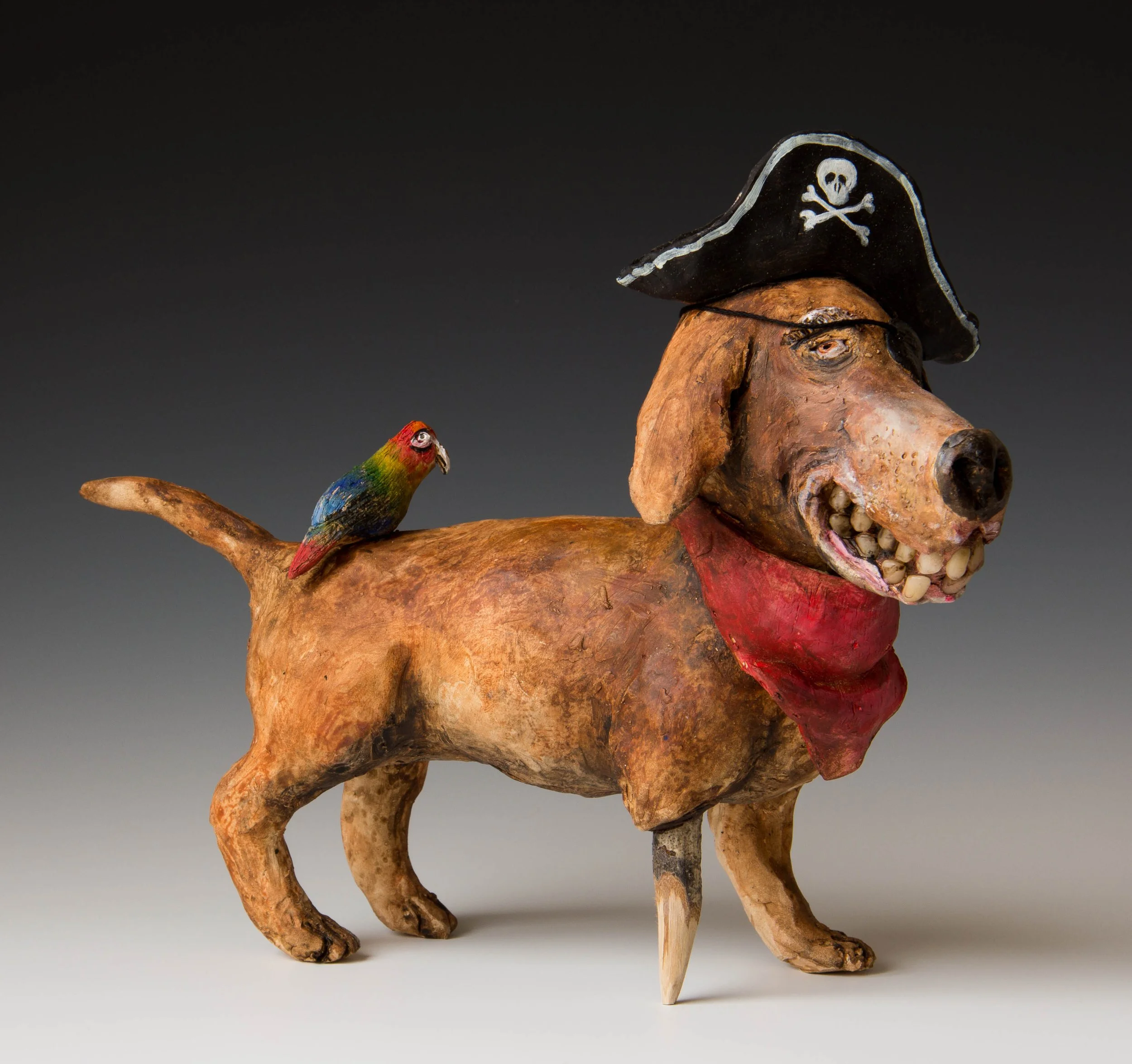"Pirate Dog" ceramic, mixed media sculpture.