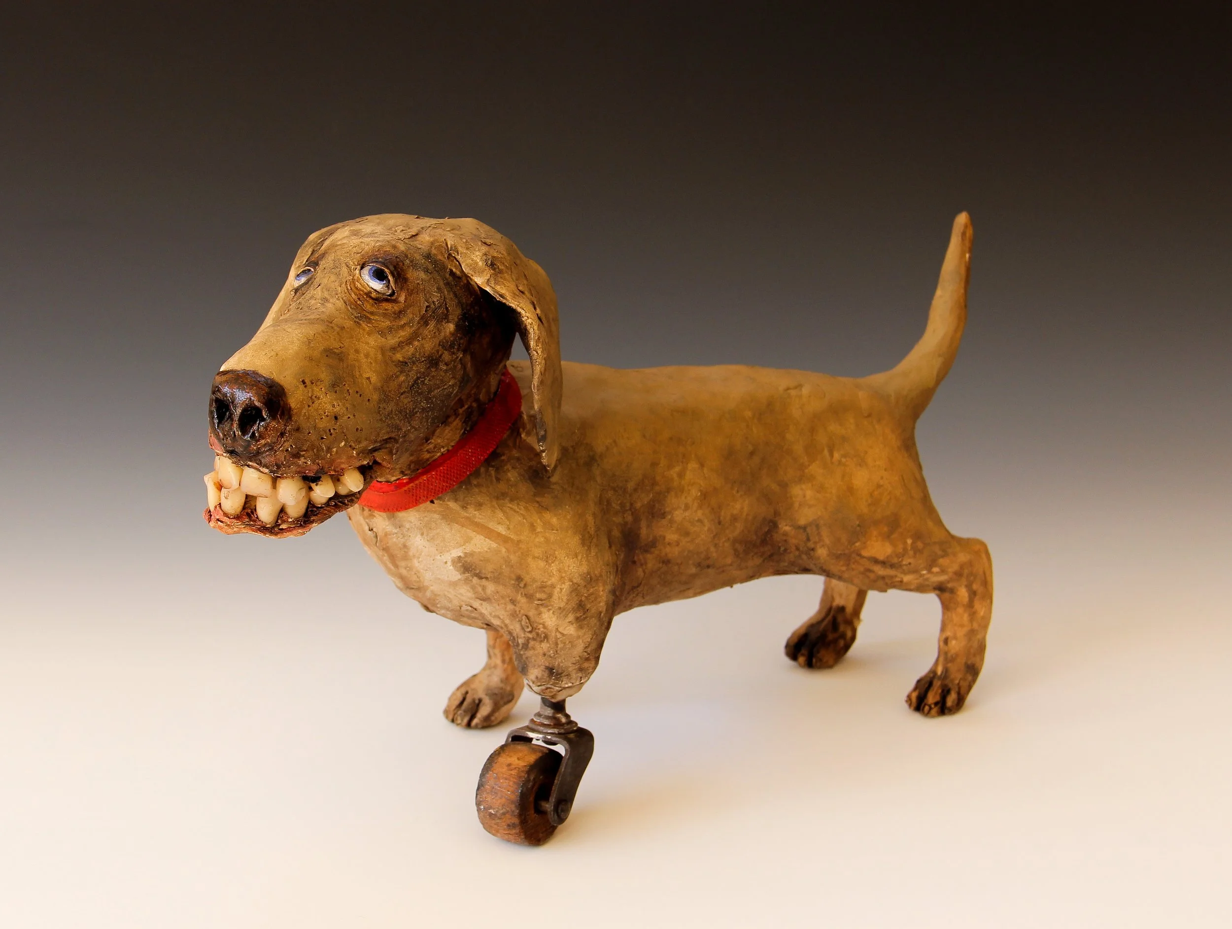SOLD Wheel Dog ceramic, mixed media sculpture.