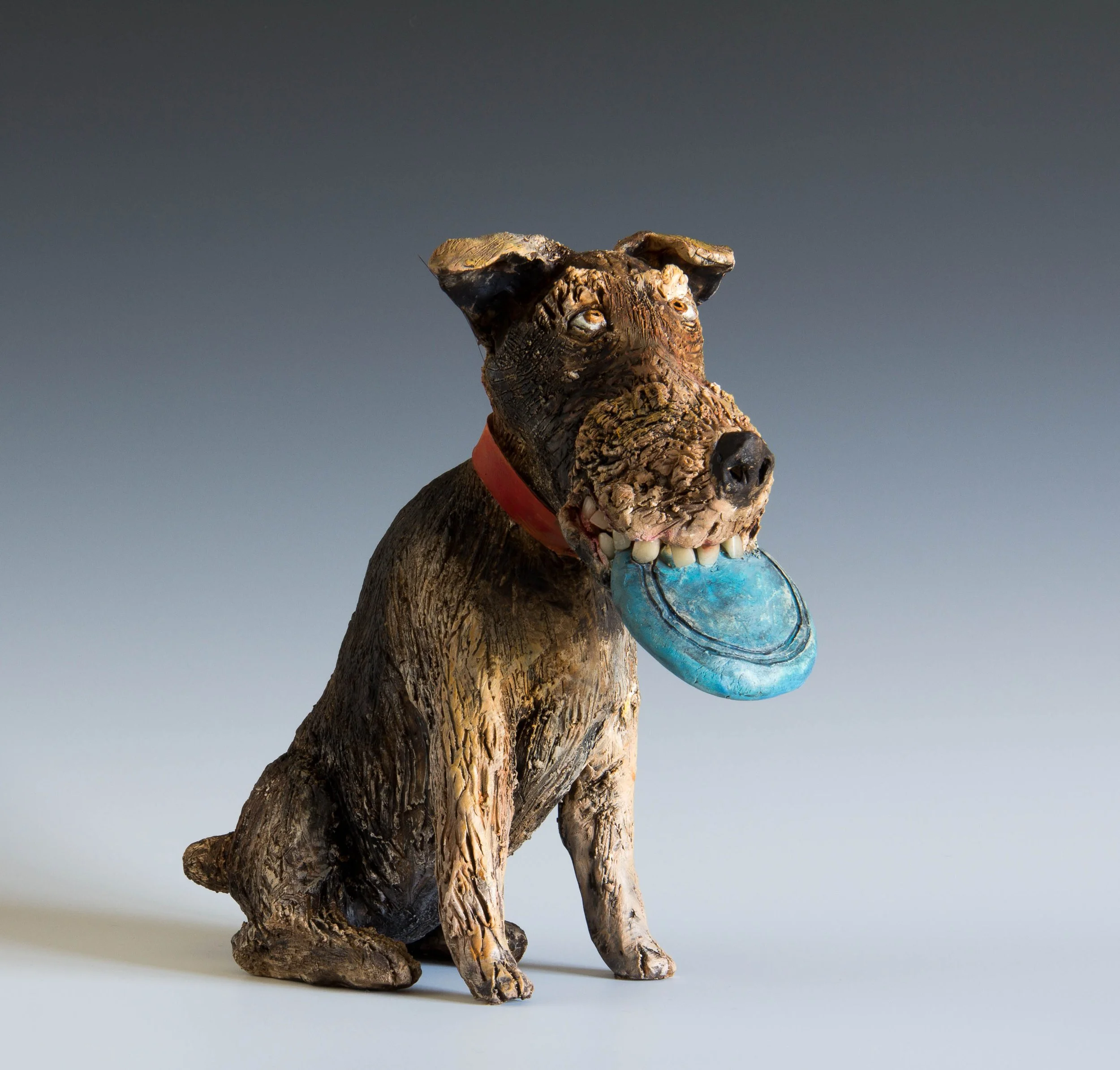 "Frisbee Terrier" ceramic sculpture.