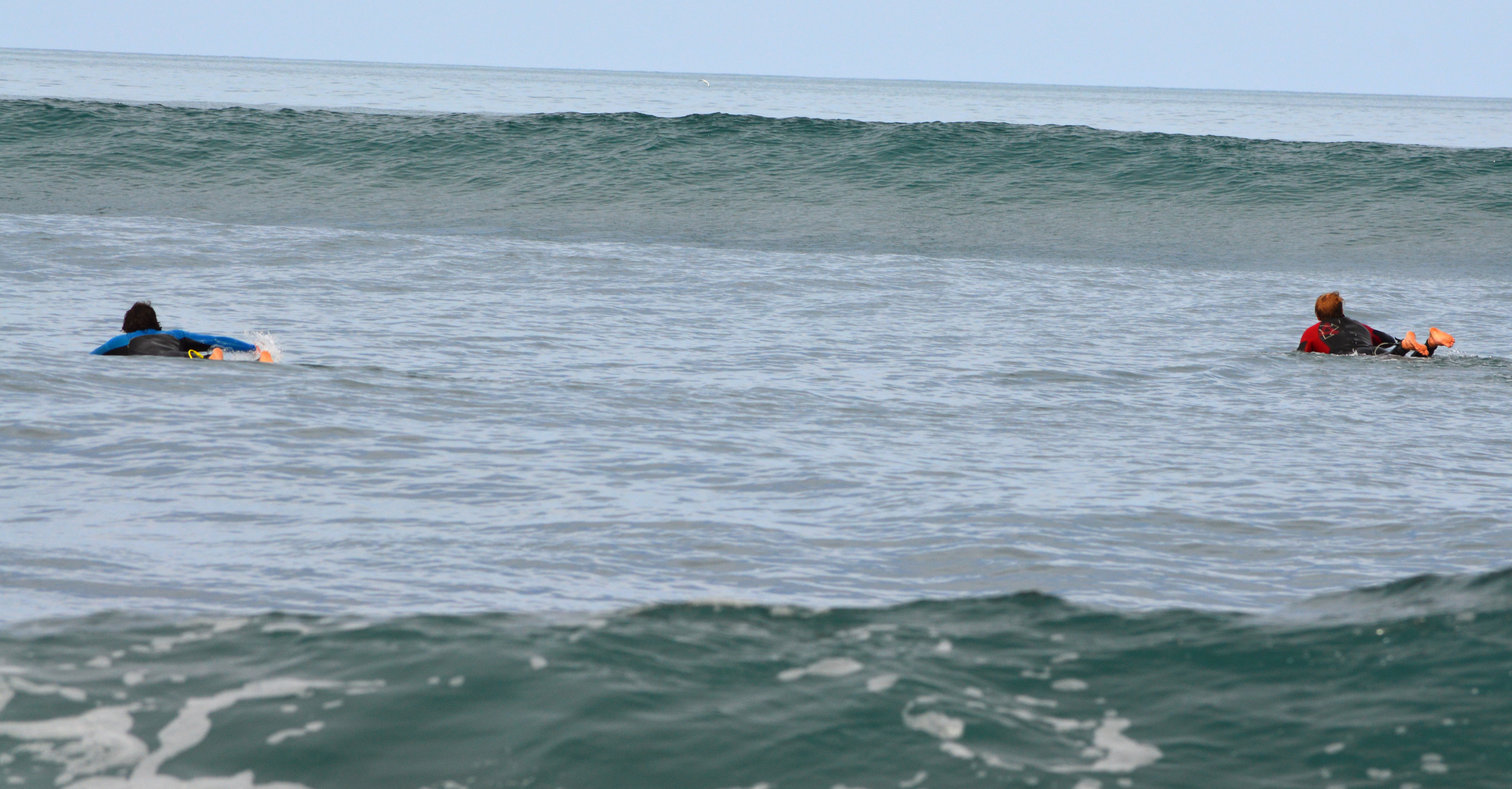 Paddling out into an empty lineup Photo@bossemarcus. Surfer left@crippoo