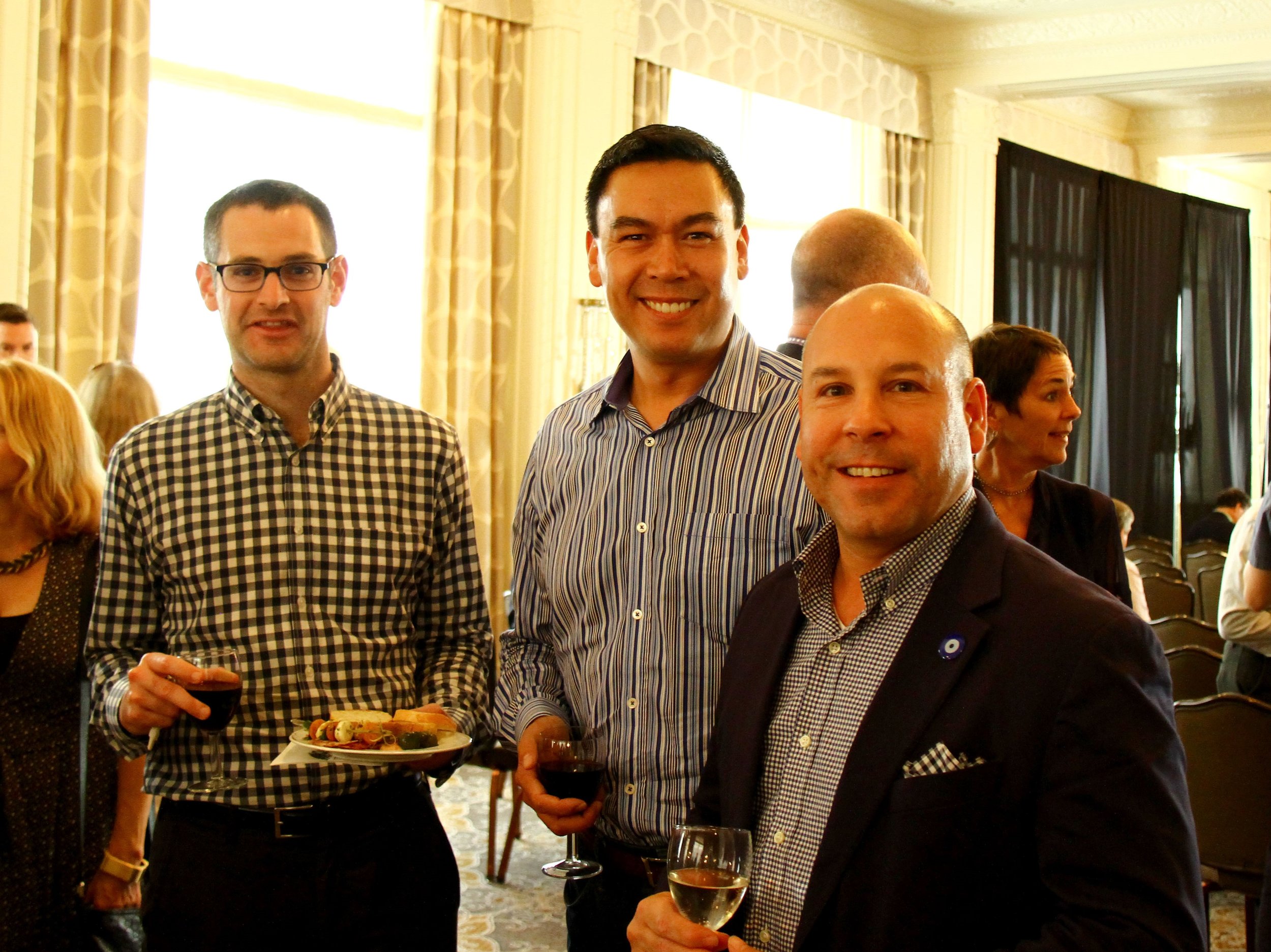 Attendees Stephen Poulakos, Michael Schmidtt, and Jonathan Winslow enjoyed light refreshments between lectures.