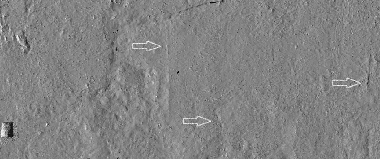 The blank impression of the Burial Chamber's north wall revealing the features normally obscured by the painting. The arrows point to the outlines in the plaster that suggest a stone 'blind wall' designed to hide the tomb's original burial chamber, as well as a smaller access doorway within the wall.