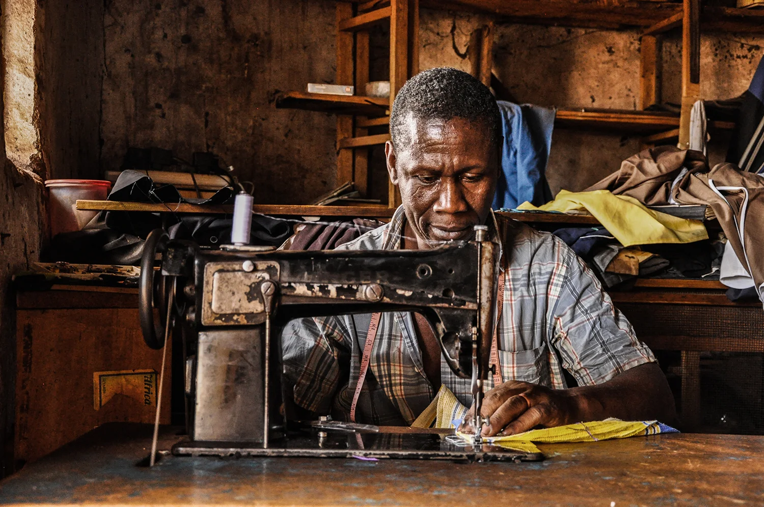 Mr. Byarugaba, also a father of four, runs a tailoring business next door and is now able to take on bigger orders since lighting up his shop a month ago.