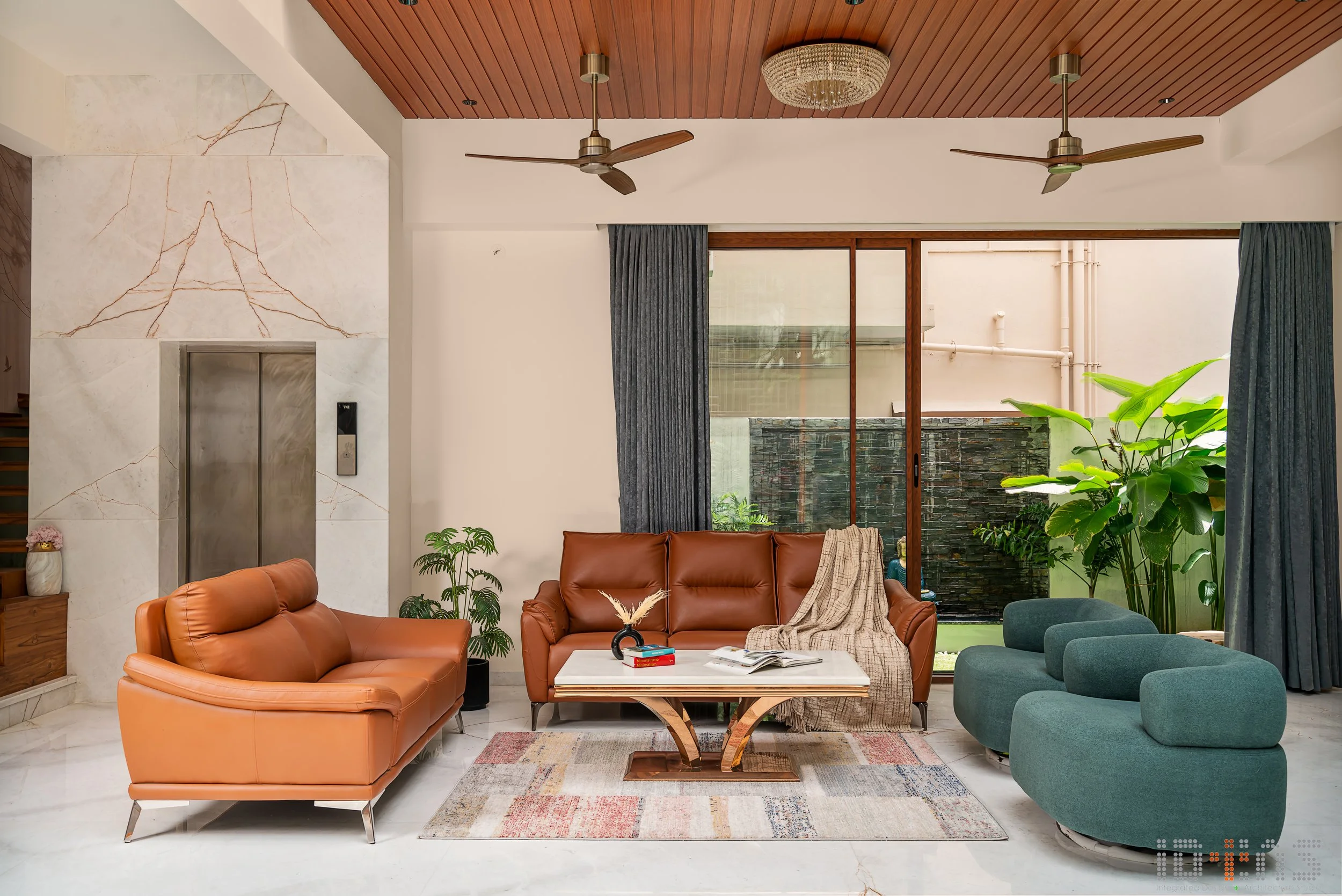 Living room with orange sofas and a rug