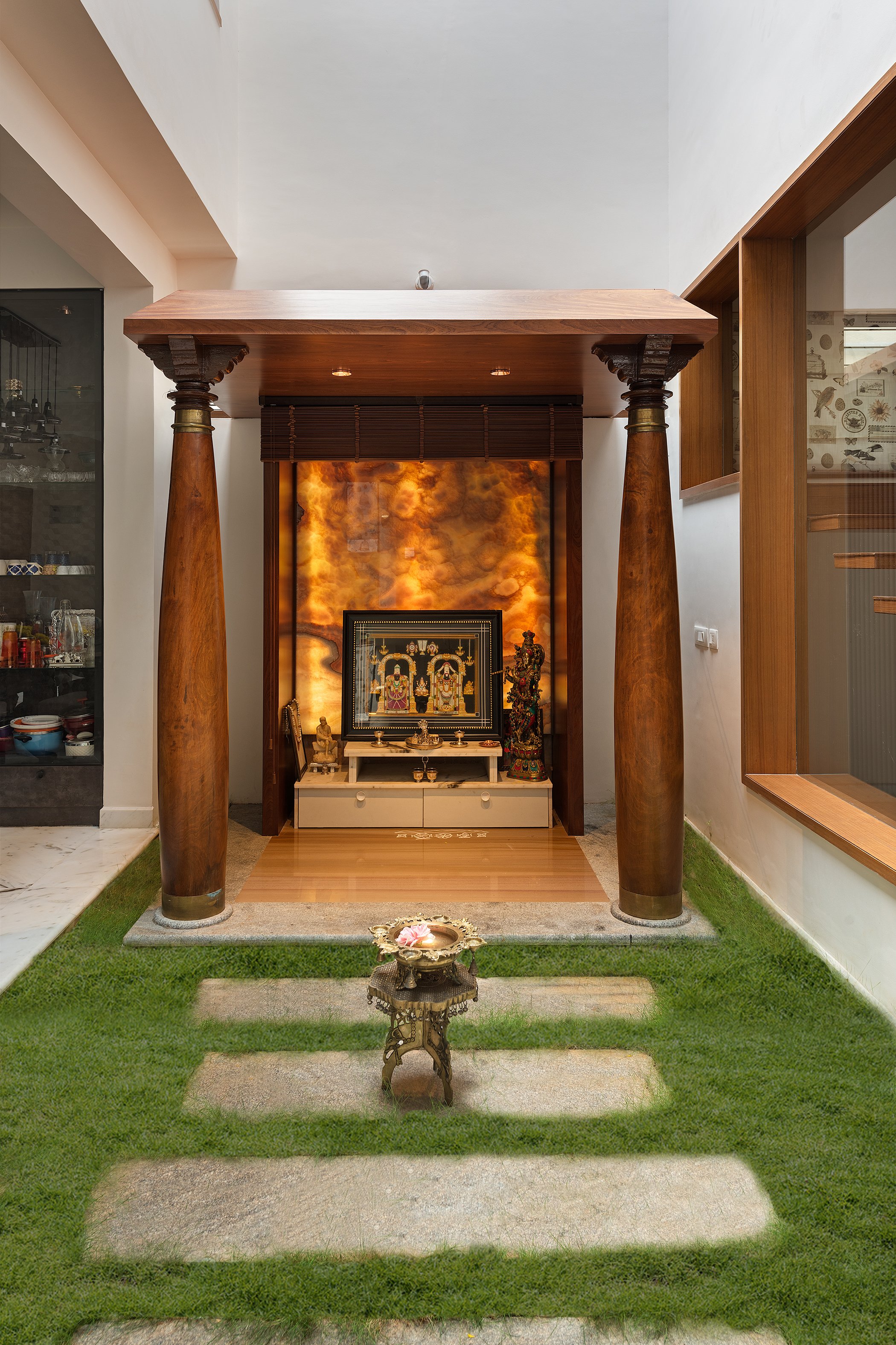 Entry walk with stepping stones and the pooja niche ahead
