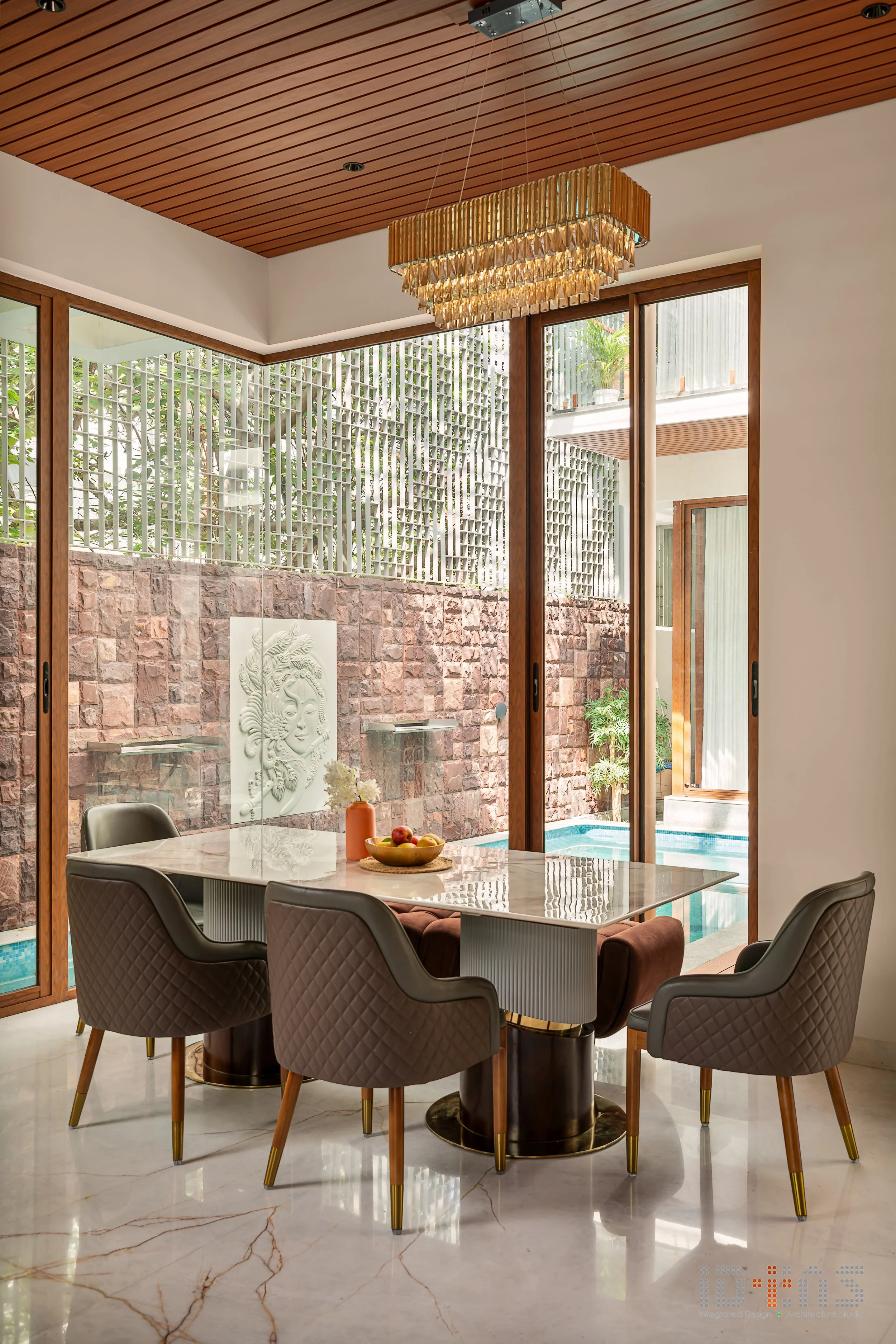 Dining table against the exposed brick wall
