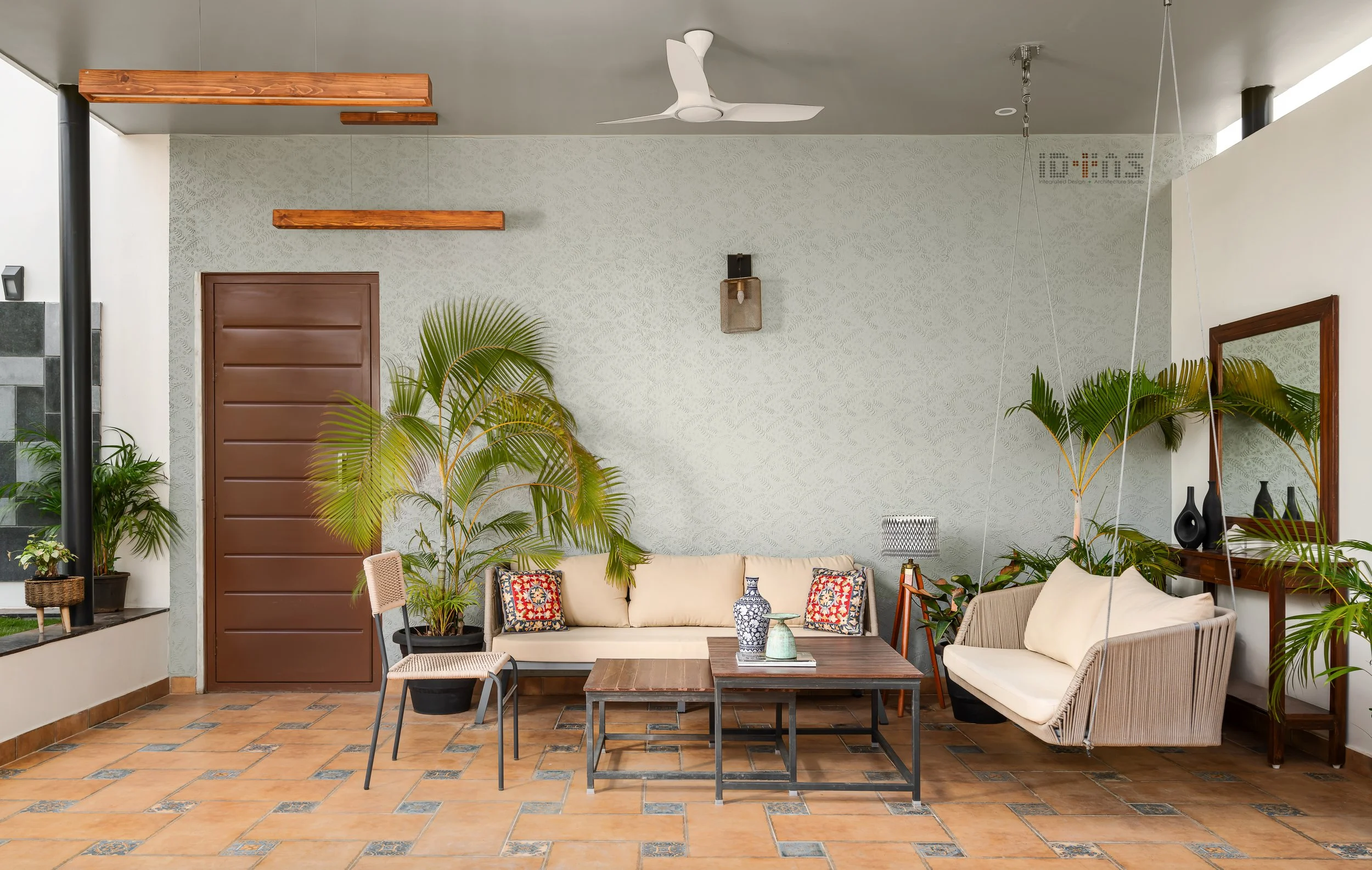 Covered patio with sofas and a mirror wall