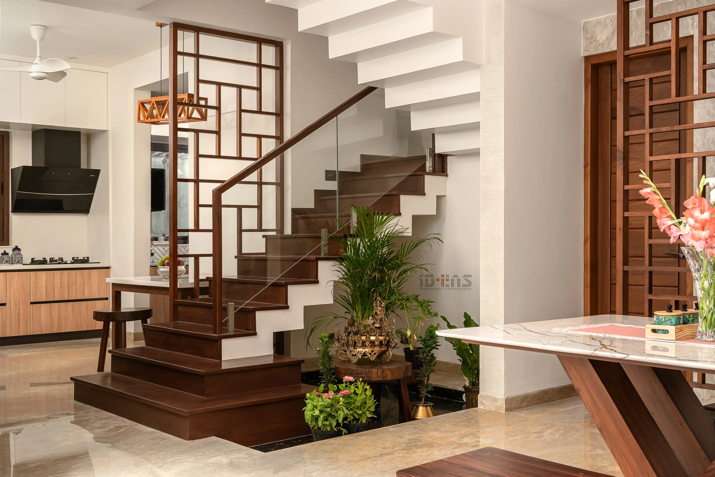 Teak staircase with the dining table beside it