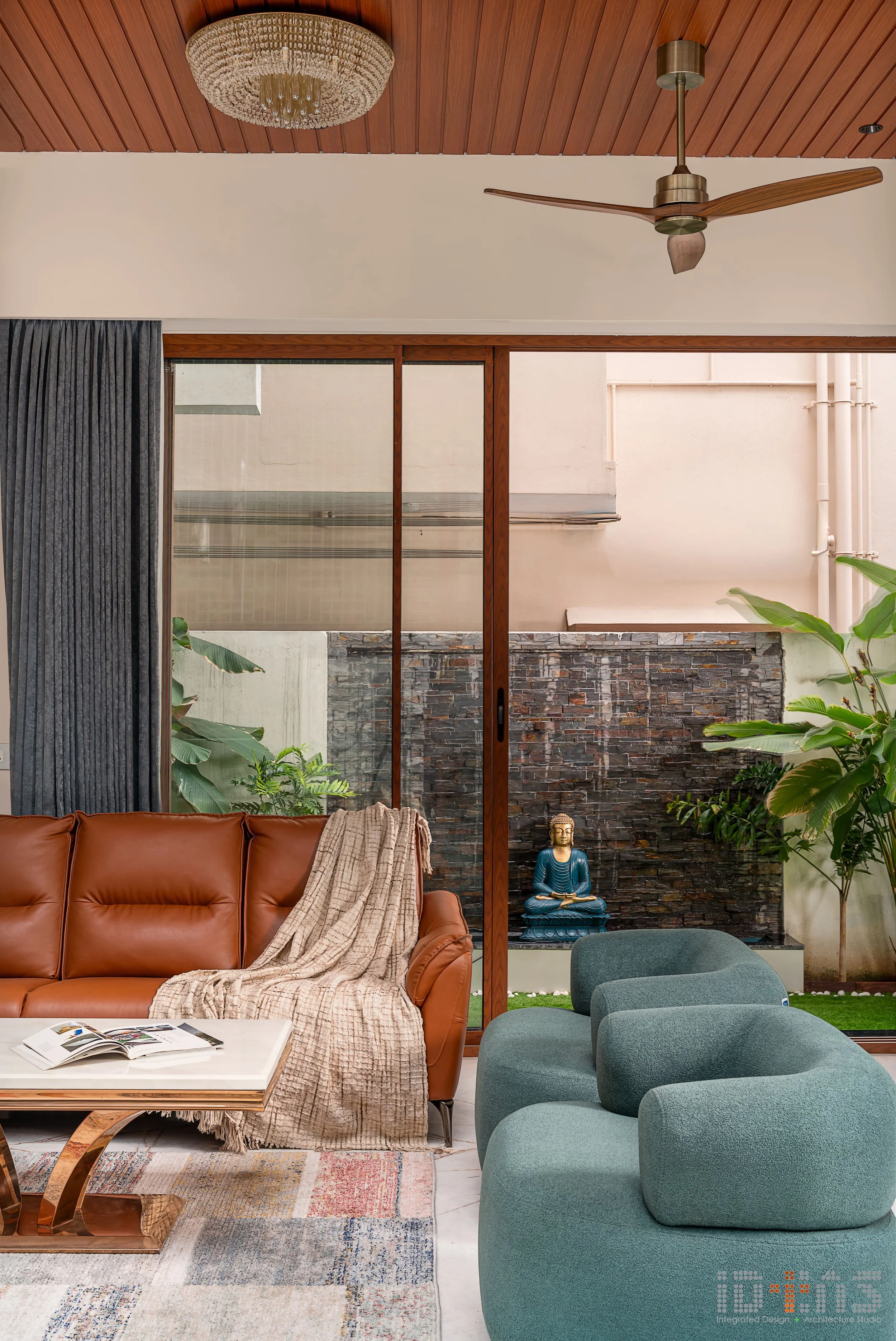 Living room corner with a teal armchair