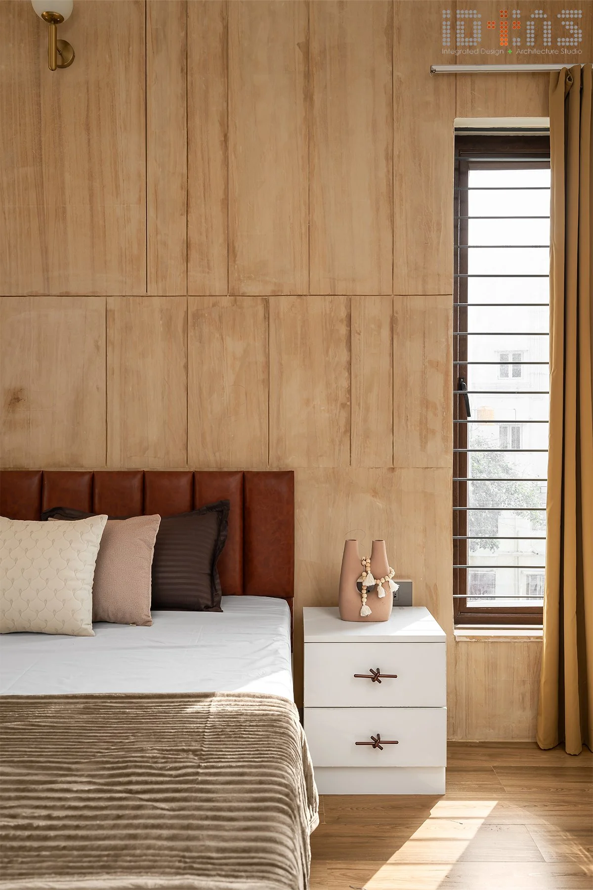 Bedroom with a timber headboard wall