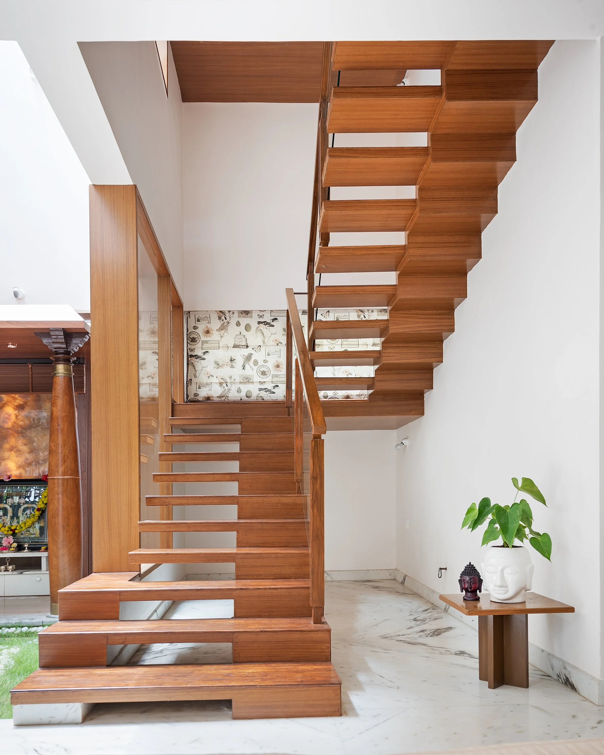 Teak staircase against a patterned wall