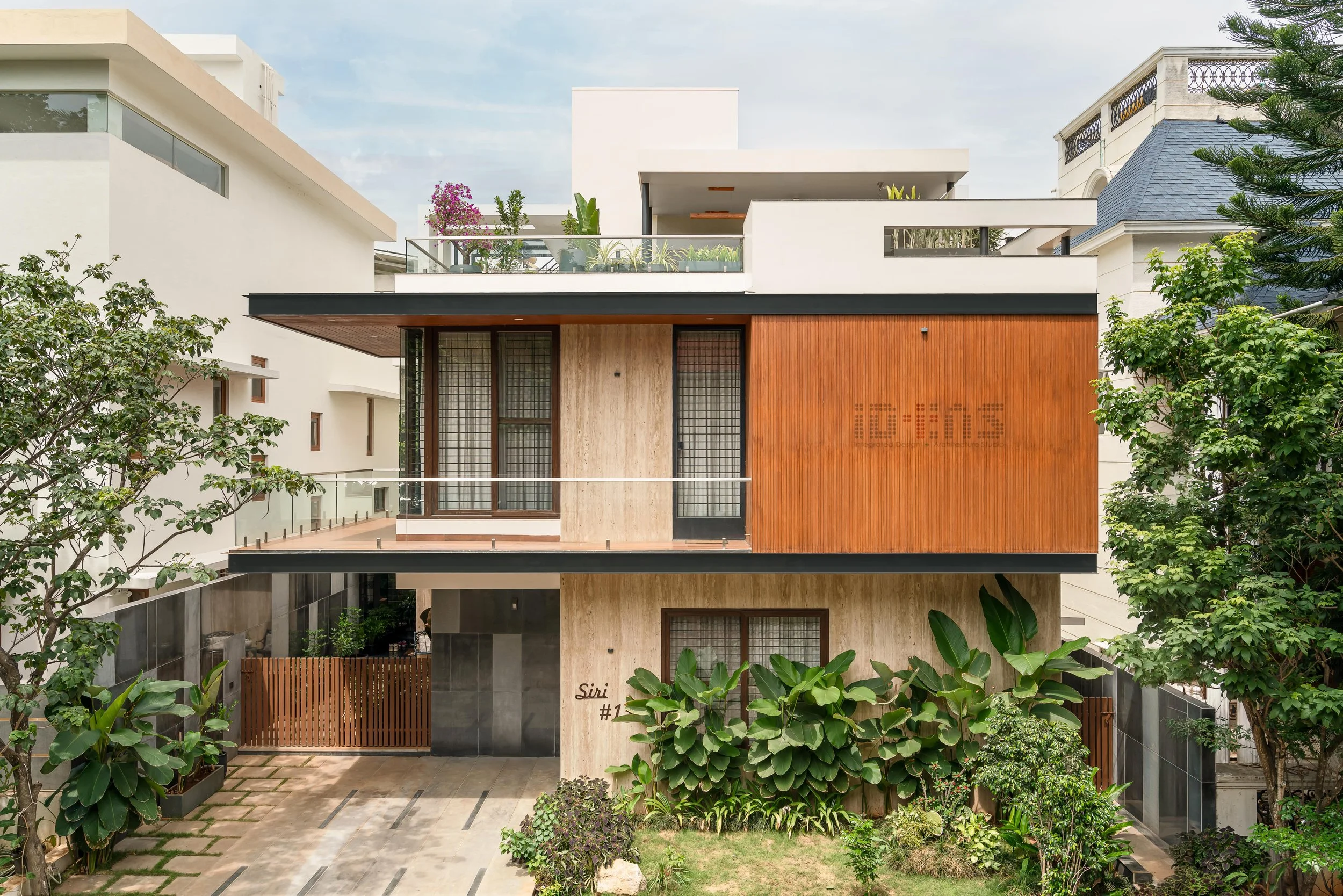Approach: timber, planting and the entrance porch