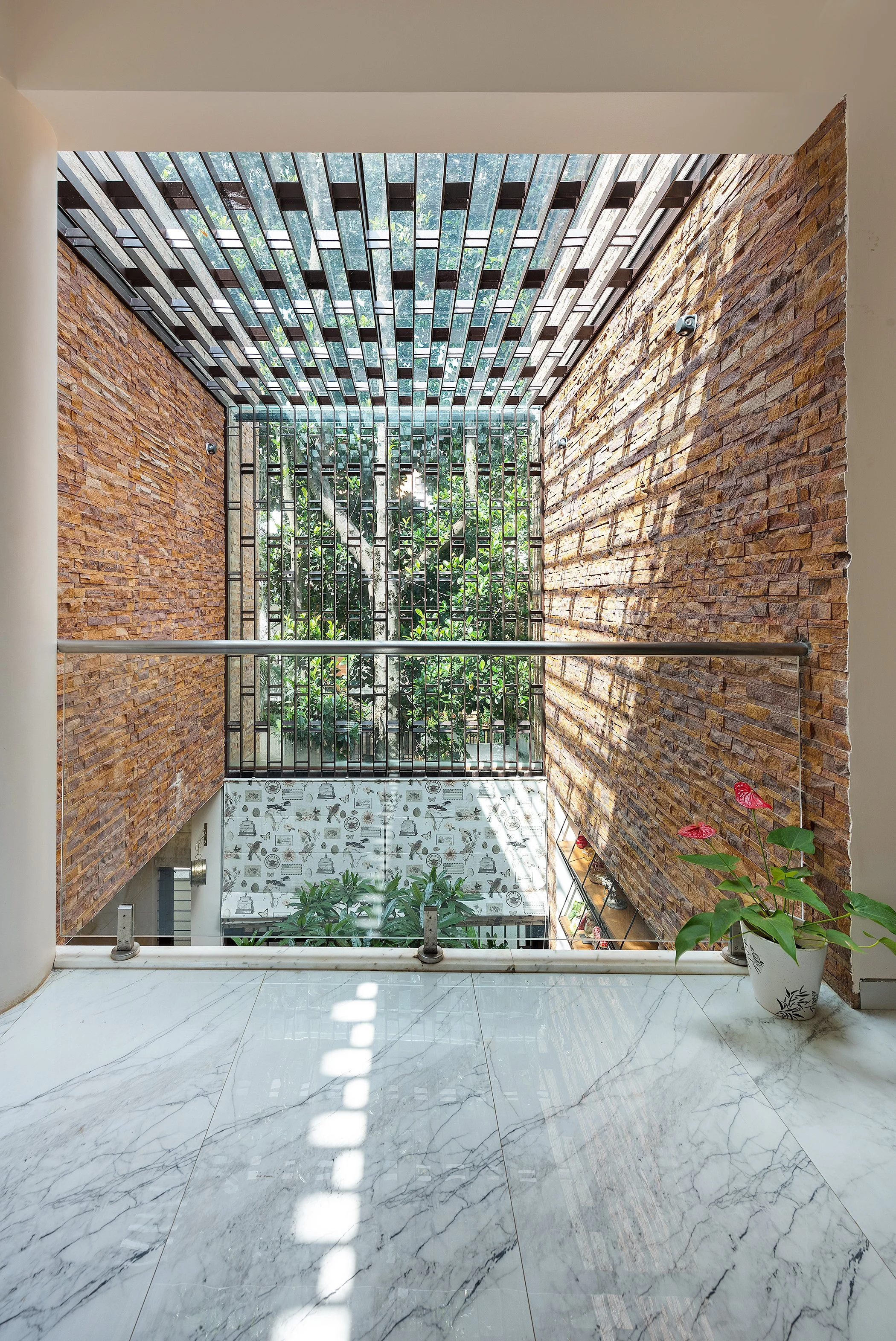 Brick courtyard with a pergola overhead