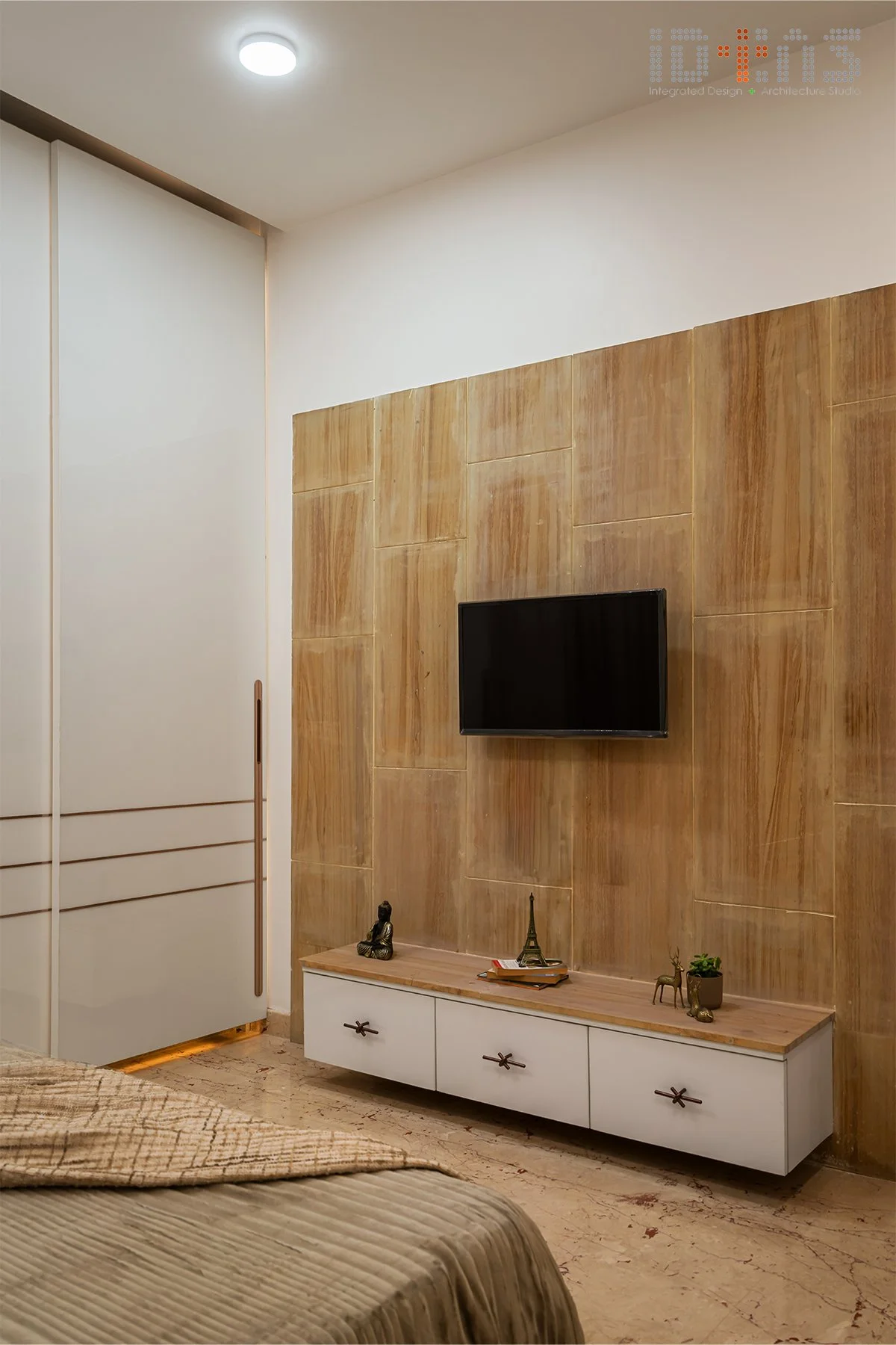 Bedroom with a timber television panel