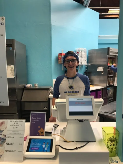 A cashier uses FiveStars at Off the Block in Capitola, CA.