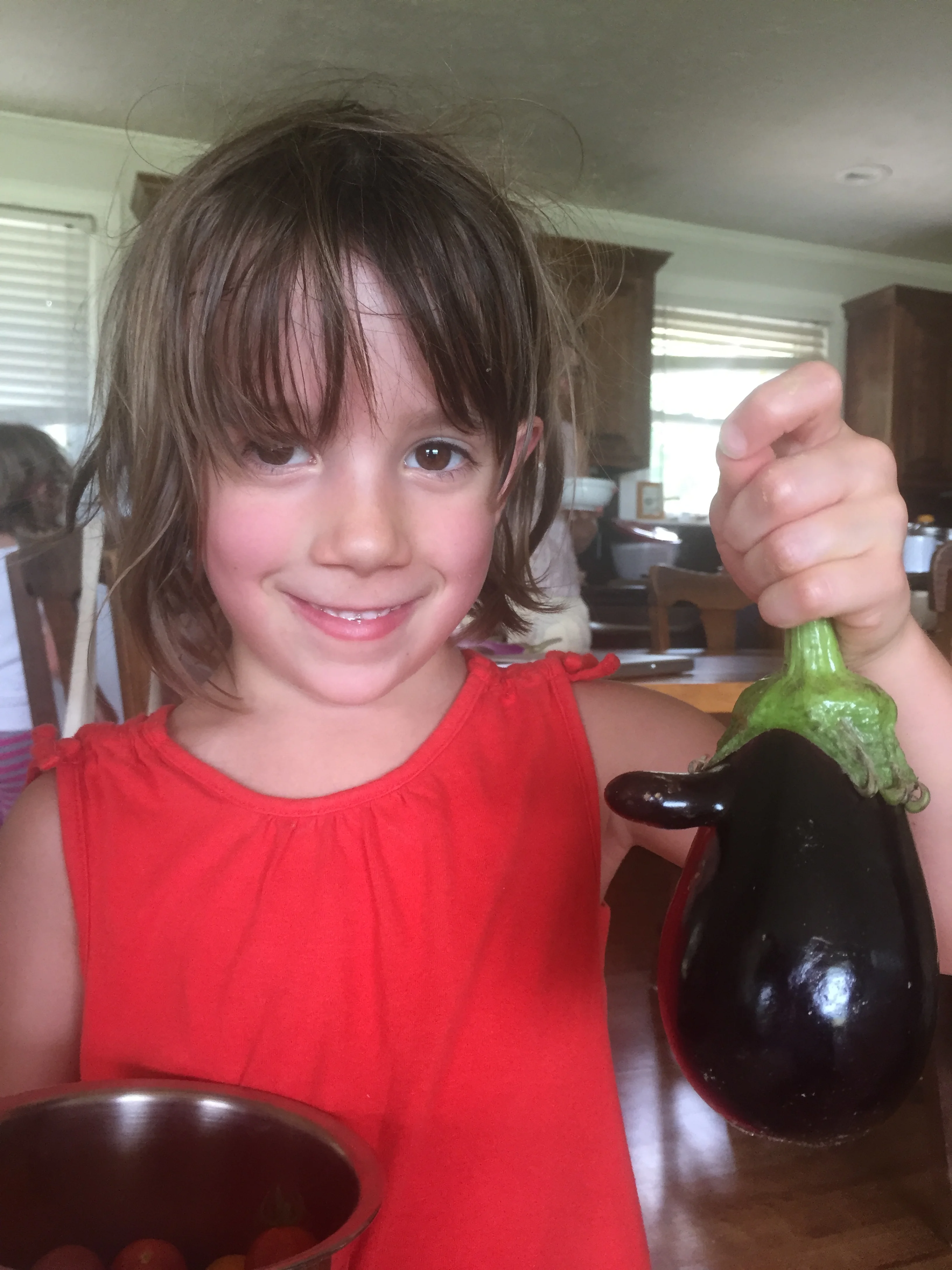 Lottie and other family members joined us for a Monday Father's Day Celebration/Family Work Party. Her eggplant has a nose! #best in-laws ever