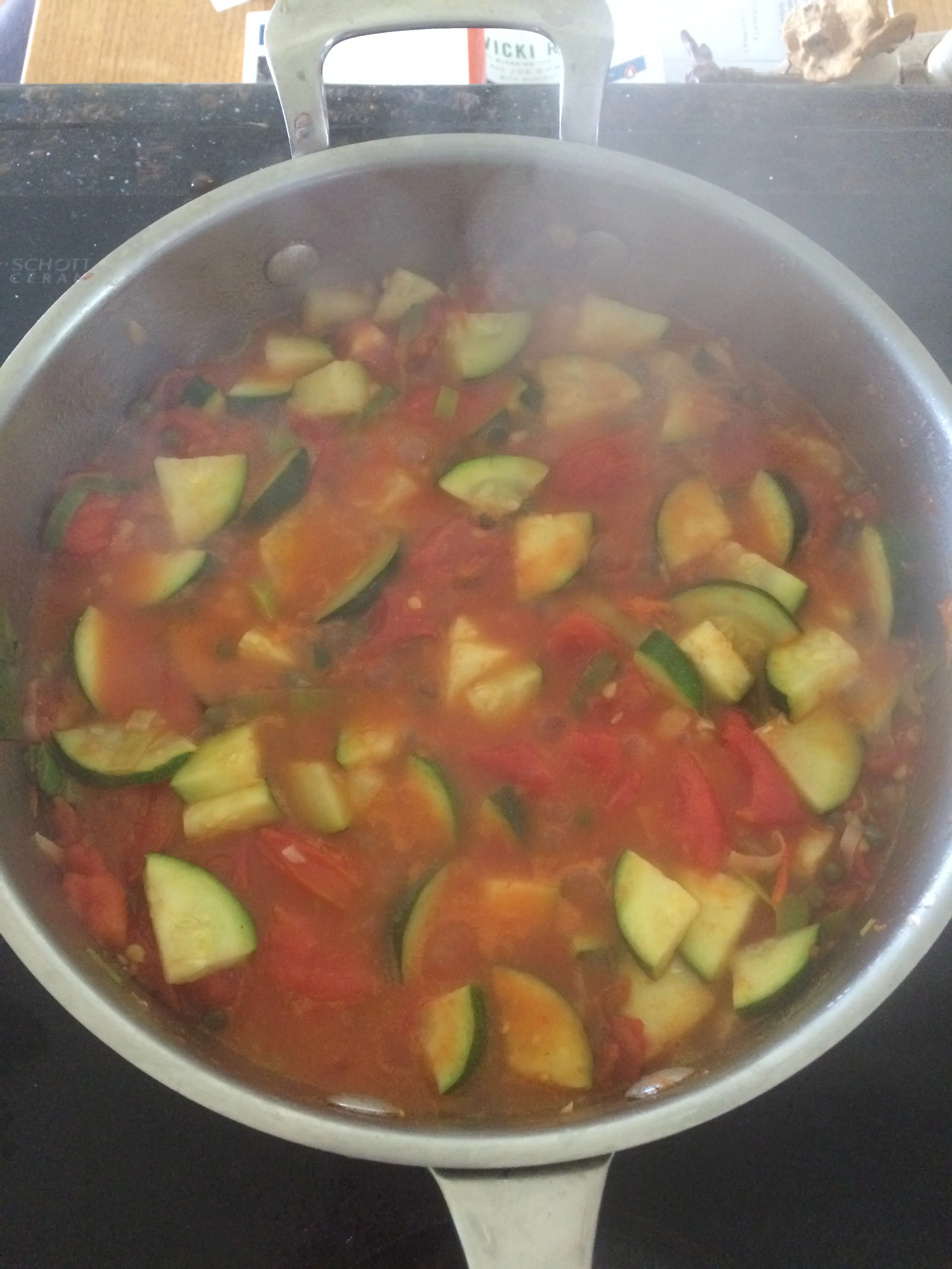 Fresh tomatoes, garlic, and leek pasta sauce with zucchini. Topped with fresh basil. 