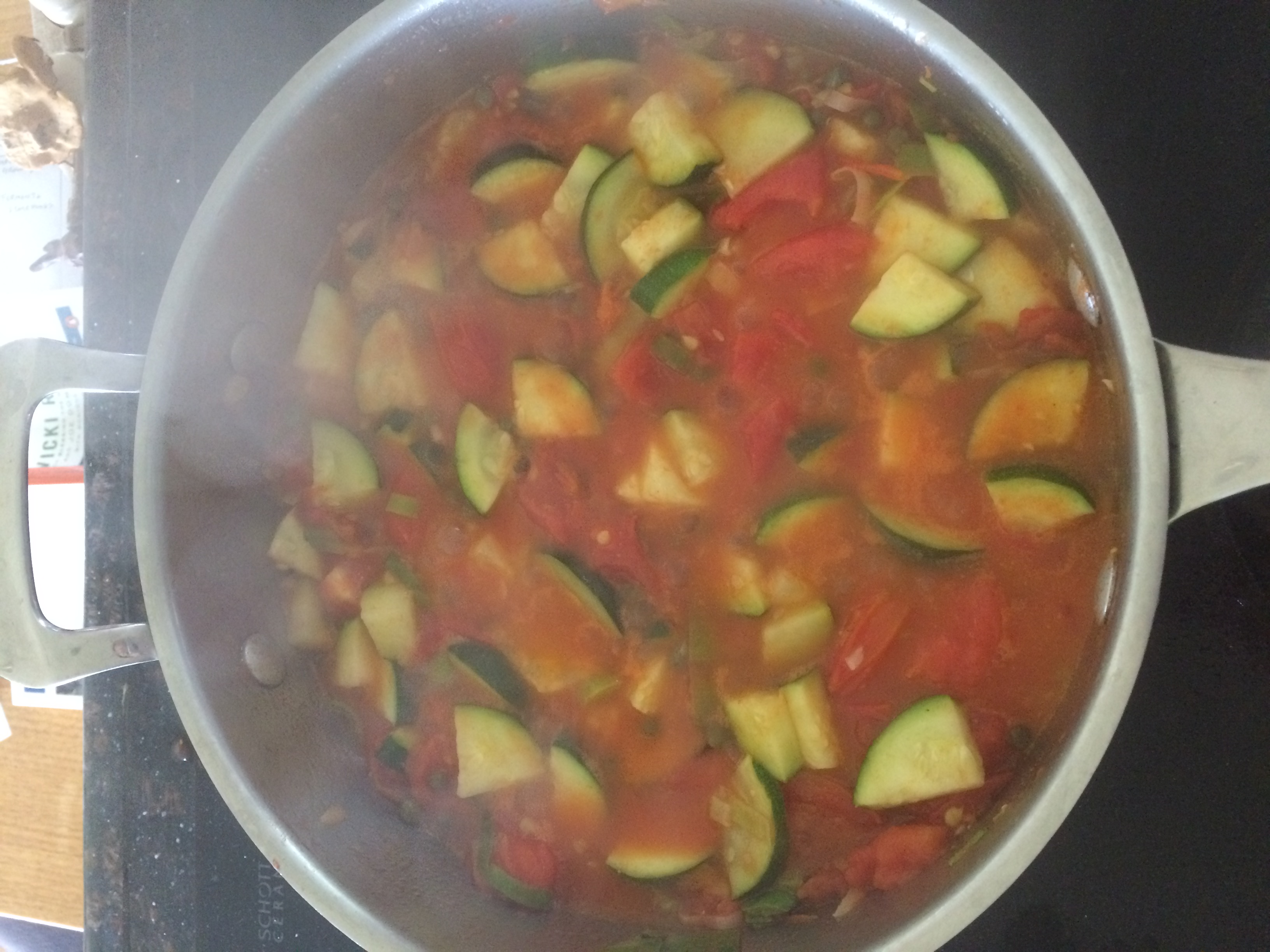 Fresh tomatoes, garlic, and leek pasta sauce with zucchini. Topped with fresh basil. 