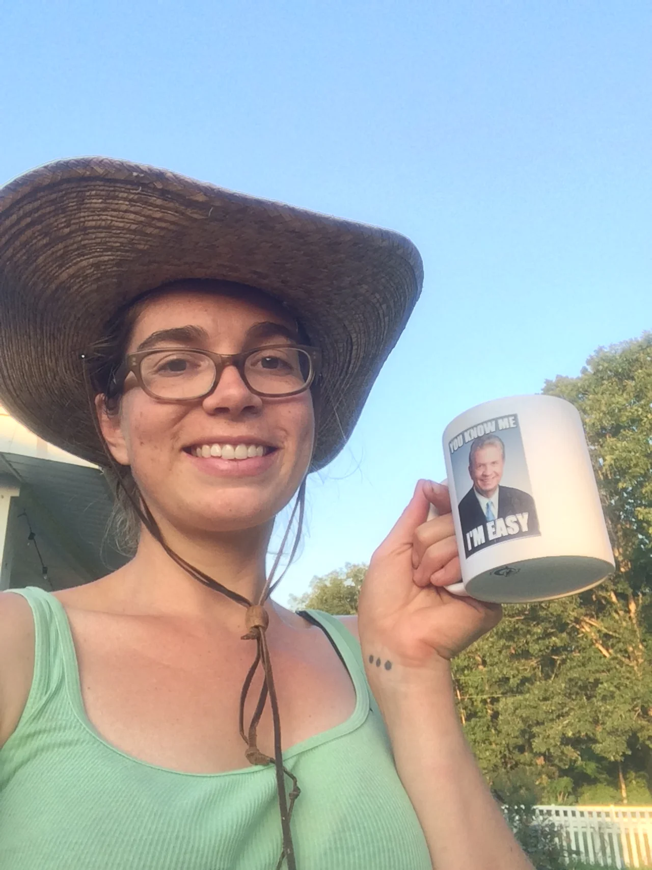 Lizzie having some iced coffee with her dad before the harvest