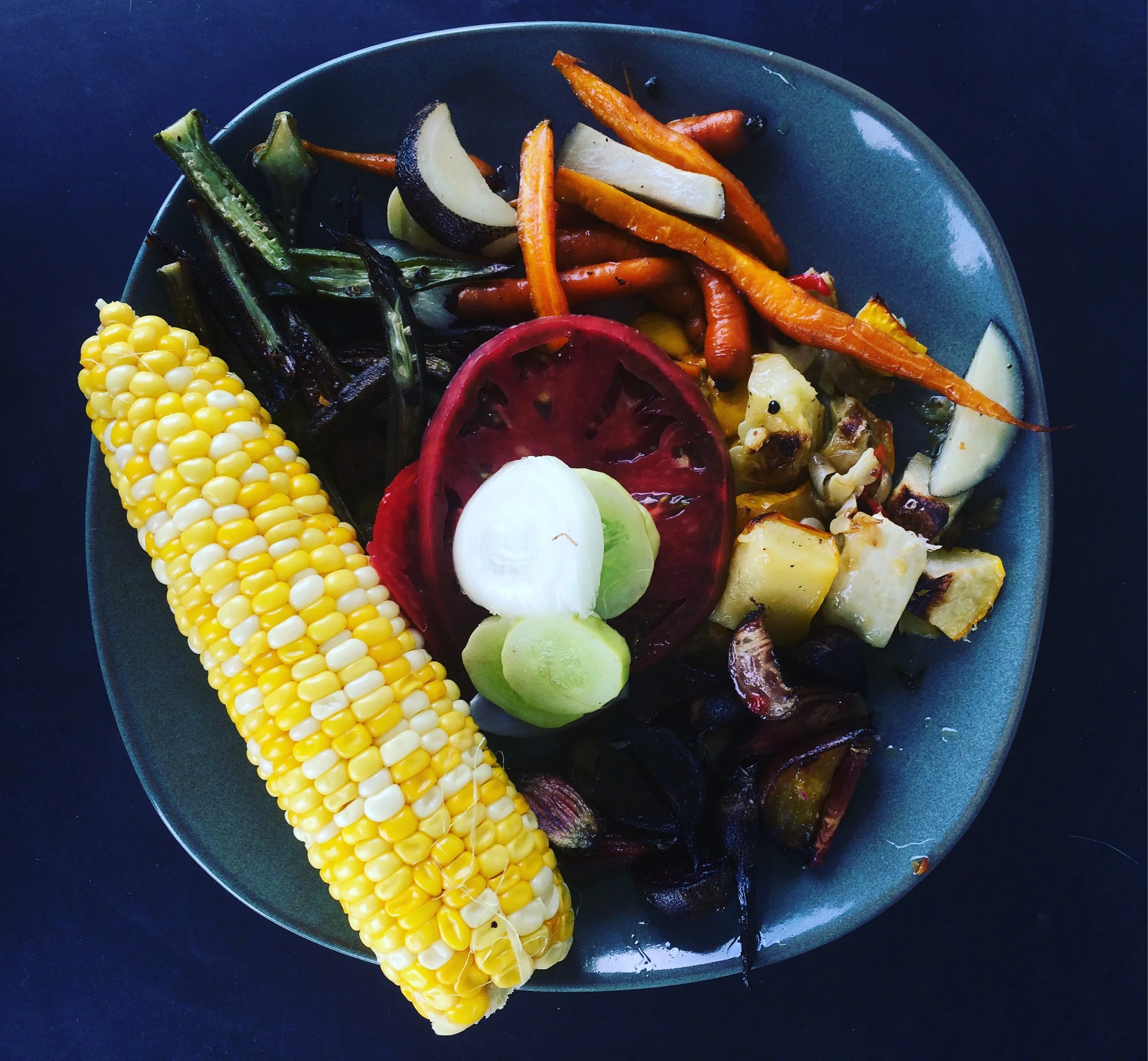 Lunch yesterday included corn on the cob, roasted okra, carrots and spanish black radish, peppers and squash, some of the last of the beets, and fresh sliced tomatoes, cucumbers and onion. It was amazing, thanks to my husband, 