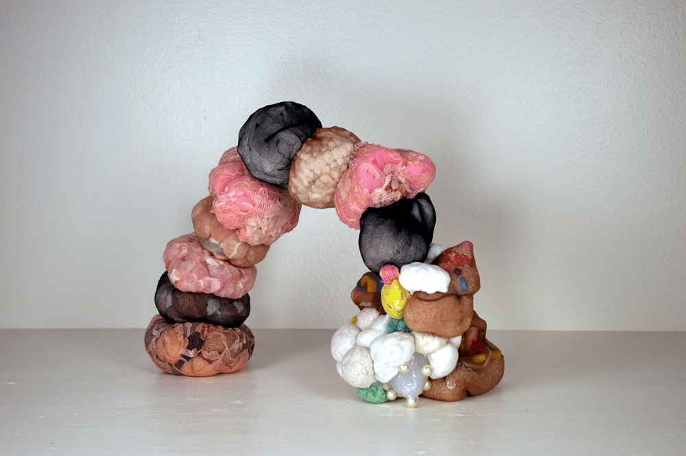 a fine, fat button of love (2017) sponges, bath mat, himalayan salt, lace, mop, dish towels, sewing pins, rice, diaper pins, waxed linen thread, nylon stockings, cotton balls, kitchen caulk, ziplock bags, erasers, dish gloves 16” x 17” x 12” * Title borrowed from the poem “Gertrude Stein Explains” by Susan Davis