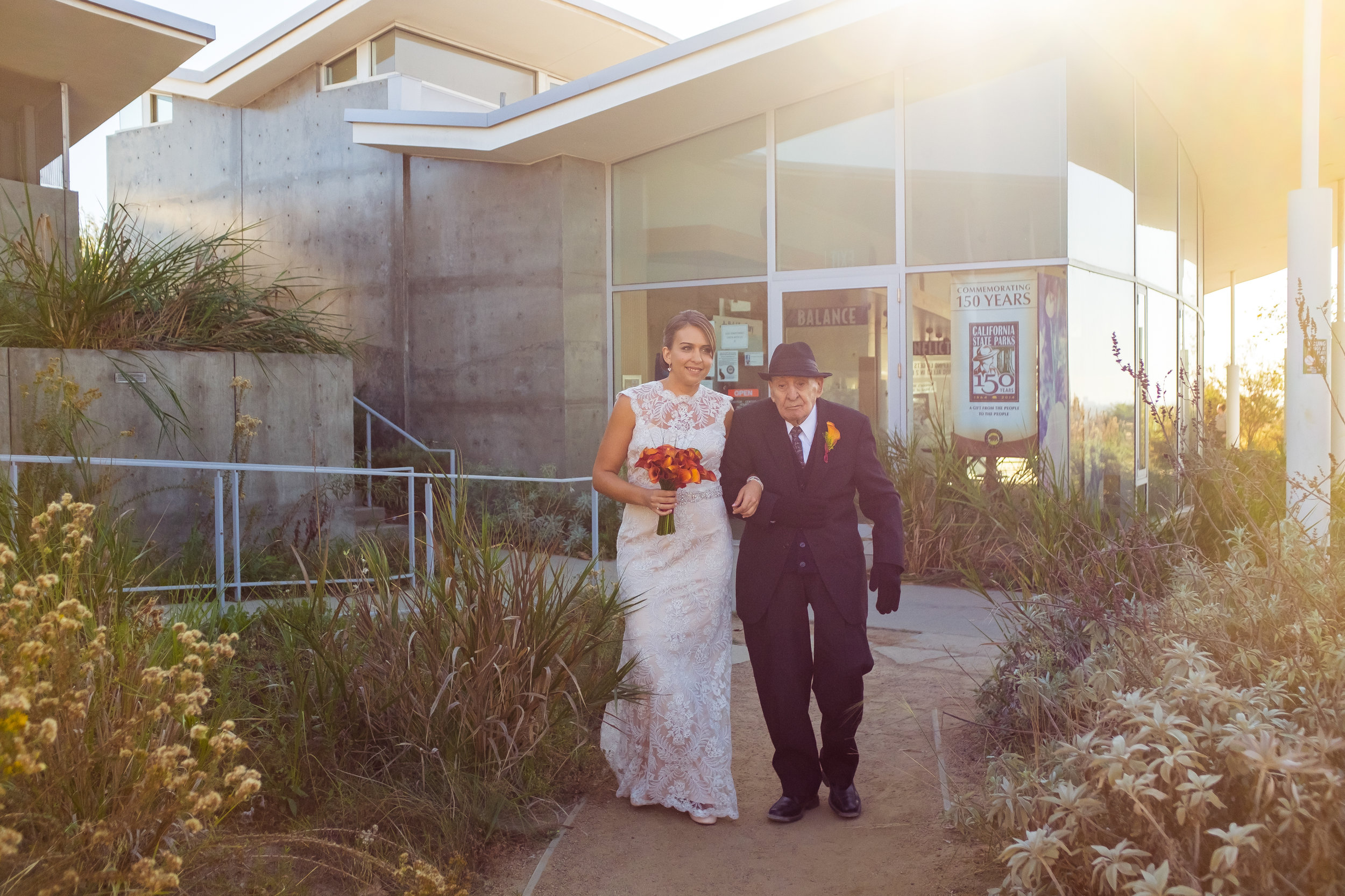 Baldwin Hills bride and her grandfather walking down the aisle