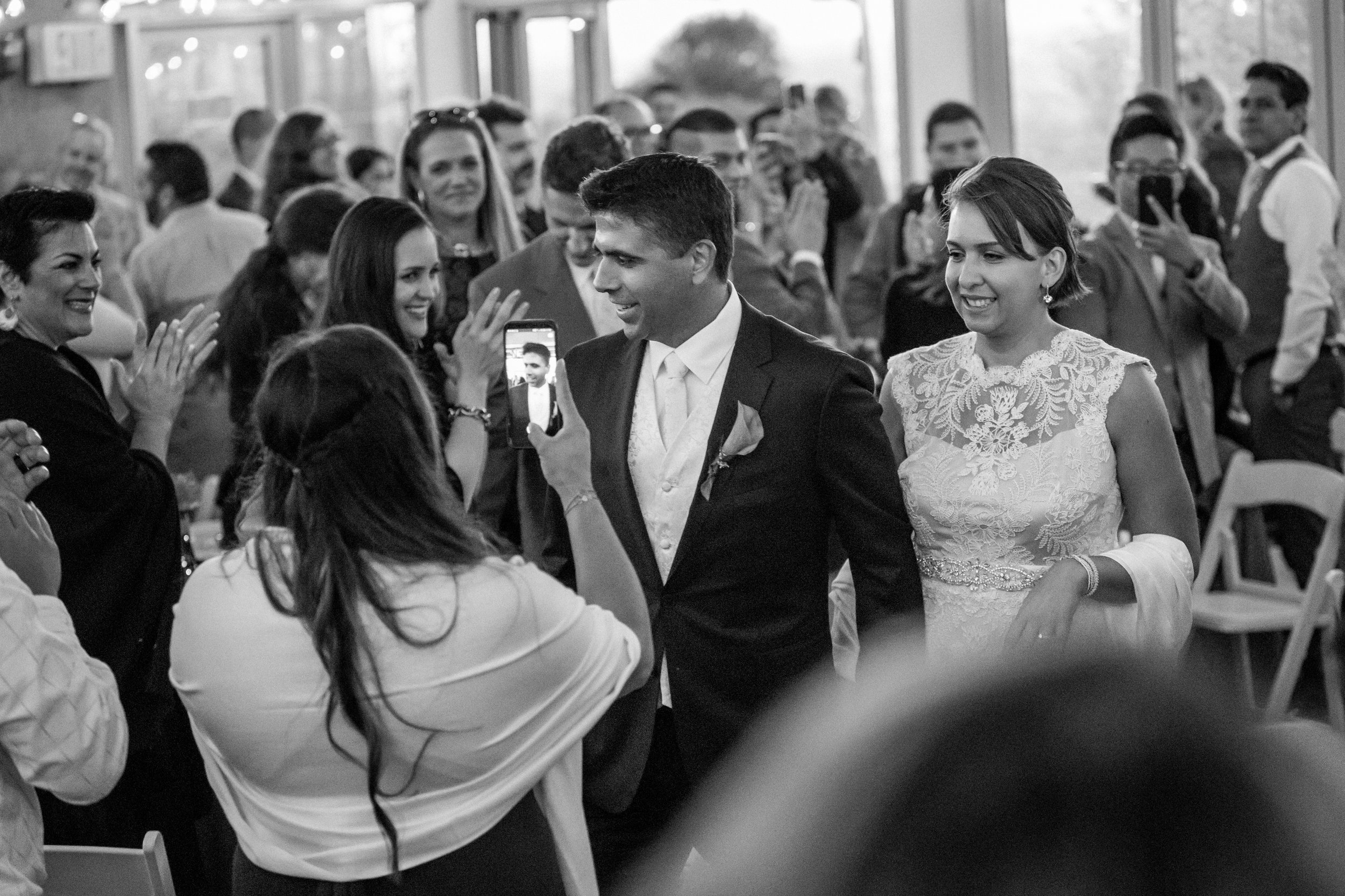 Bride and groom being greeted at their wedding reception in Baldwin Hills