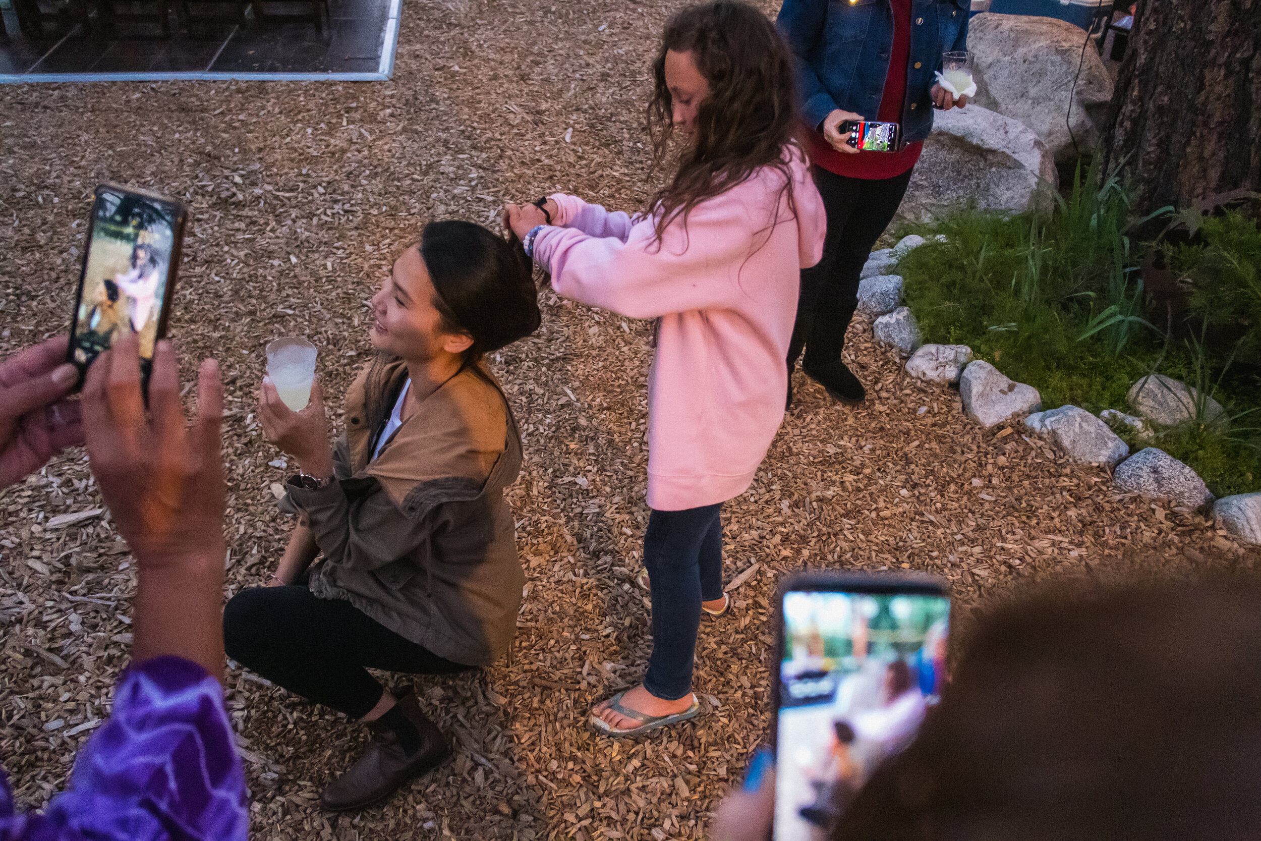 At a casual welcome dinner on mountains, the flowergirl and I were having some fun with my long hair.