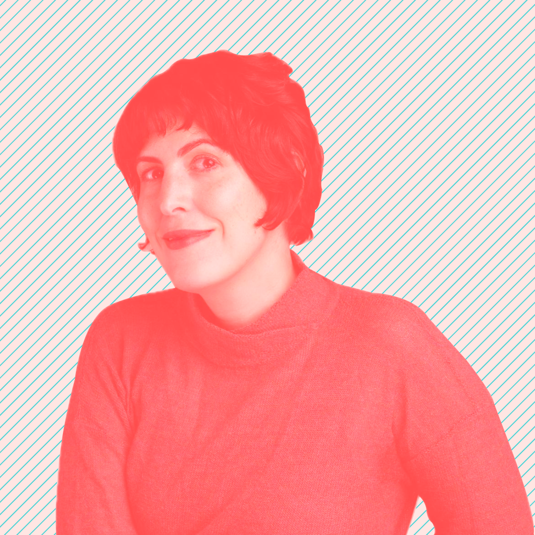 Headshot of a pale woman with dark brown short hear, dark eyes and eyebrows, a lips painted red. She's wearing a brown knitted turtleneck.