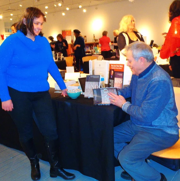 Signing a copy of The Lies That Bind at today's "extravaganza."