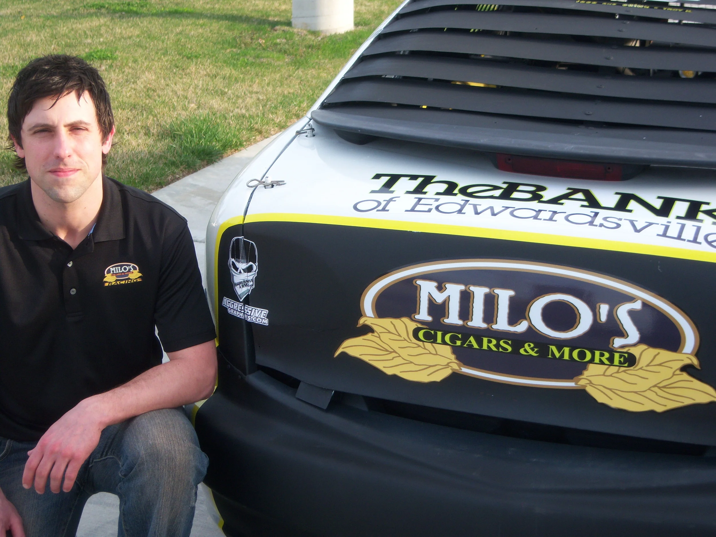 Arron with Milo's Logo.jpg