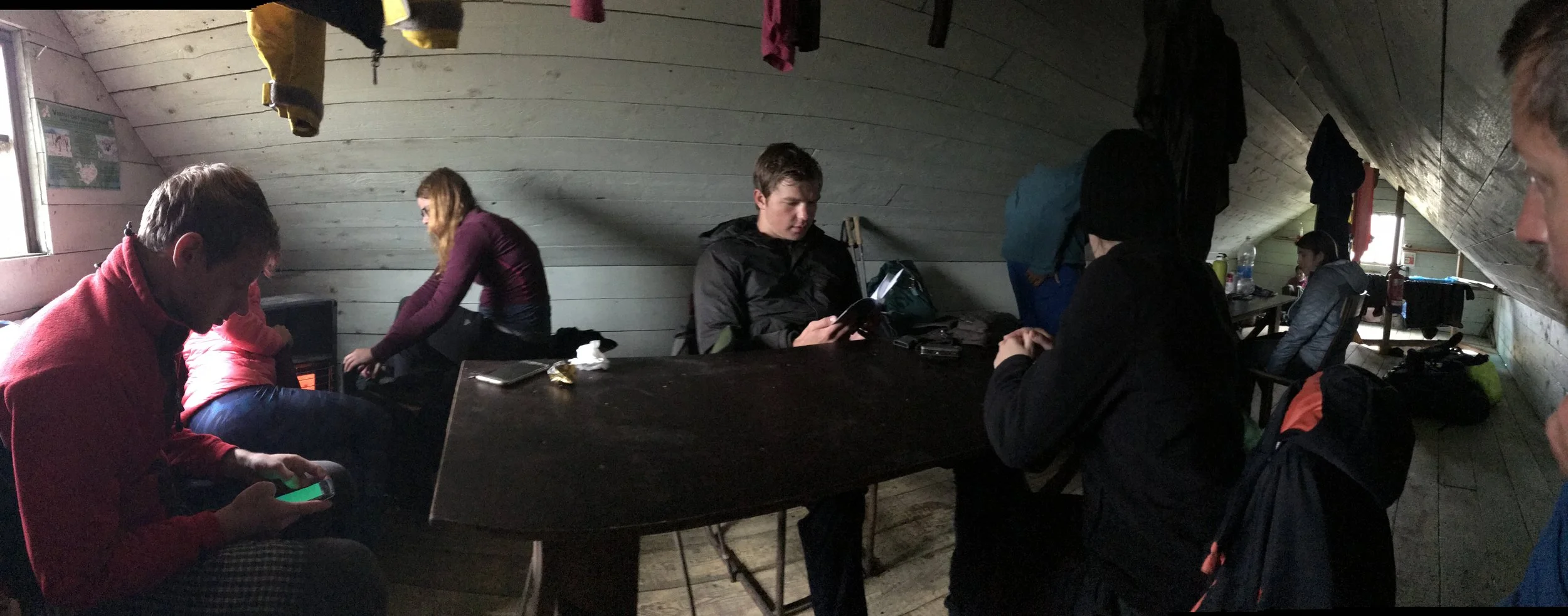 Inside the barn attempting to dry out and warm up with other trekkers