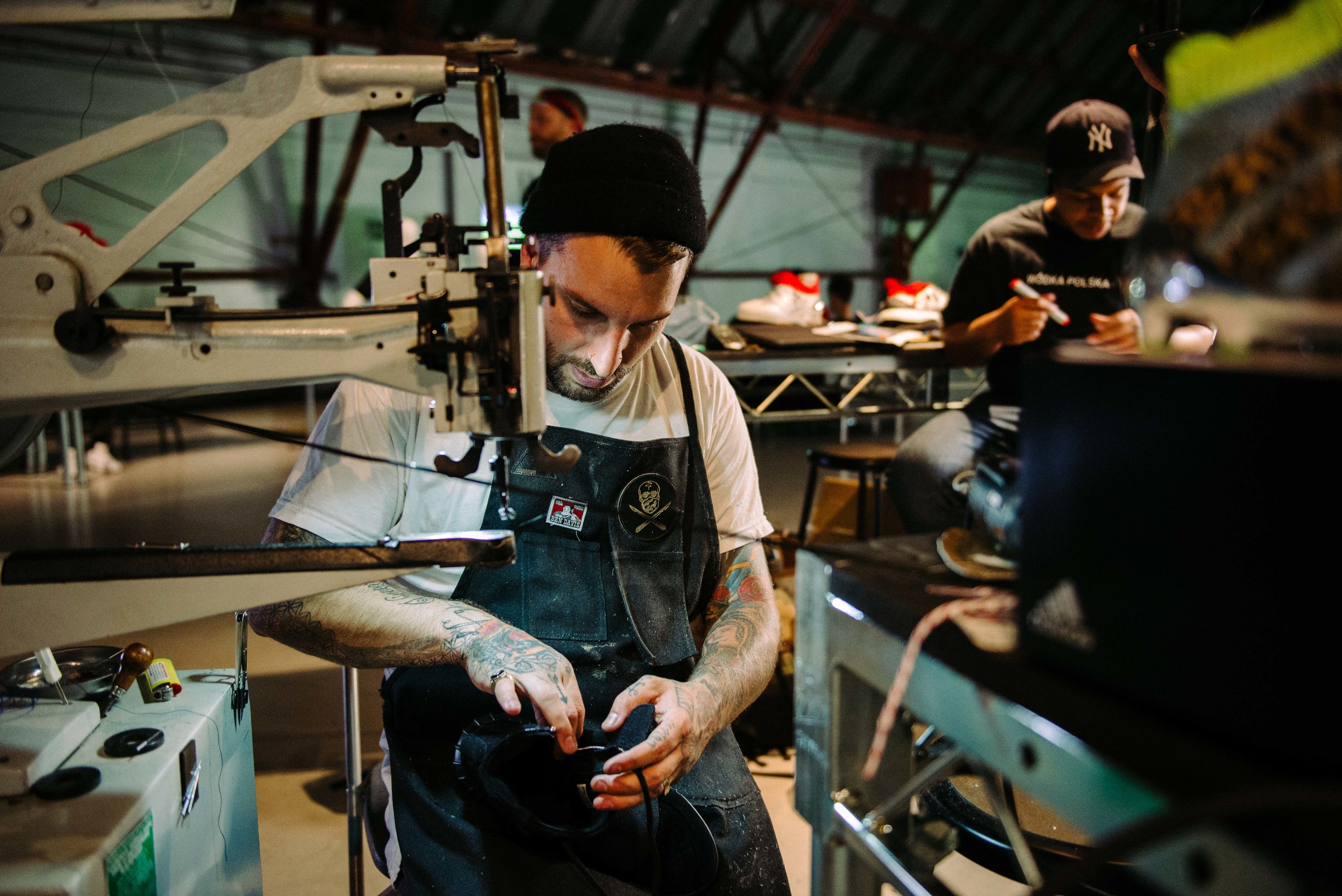  The Shoe Surgeon (Dominic Chambrone) customizing soccer cleats – and &nbsp;black Yeezy 750's –&nbsp;at Adidas' Mercury Center. / Photo: © Diane Abapo for SUSPEND Magazine. 