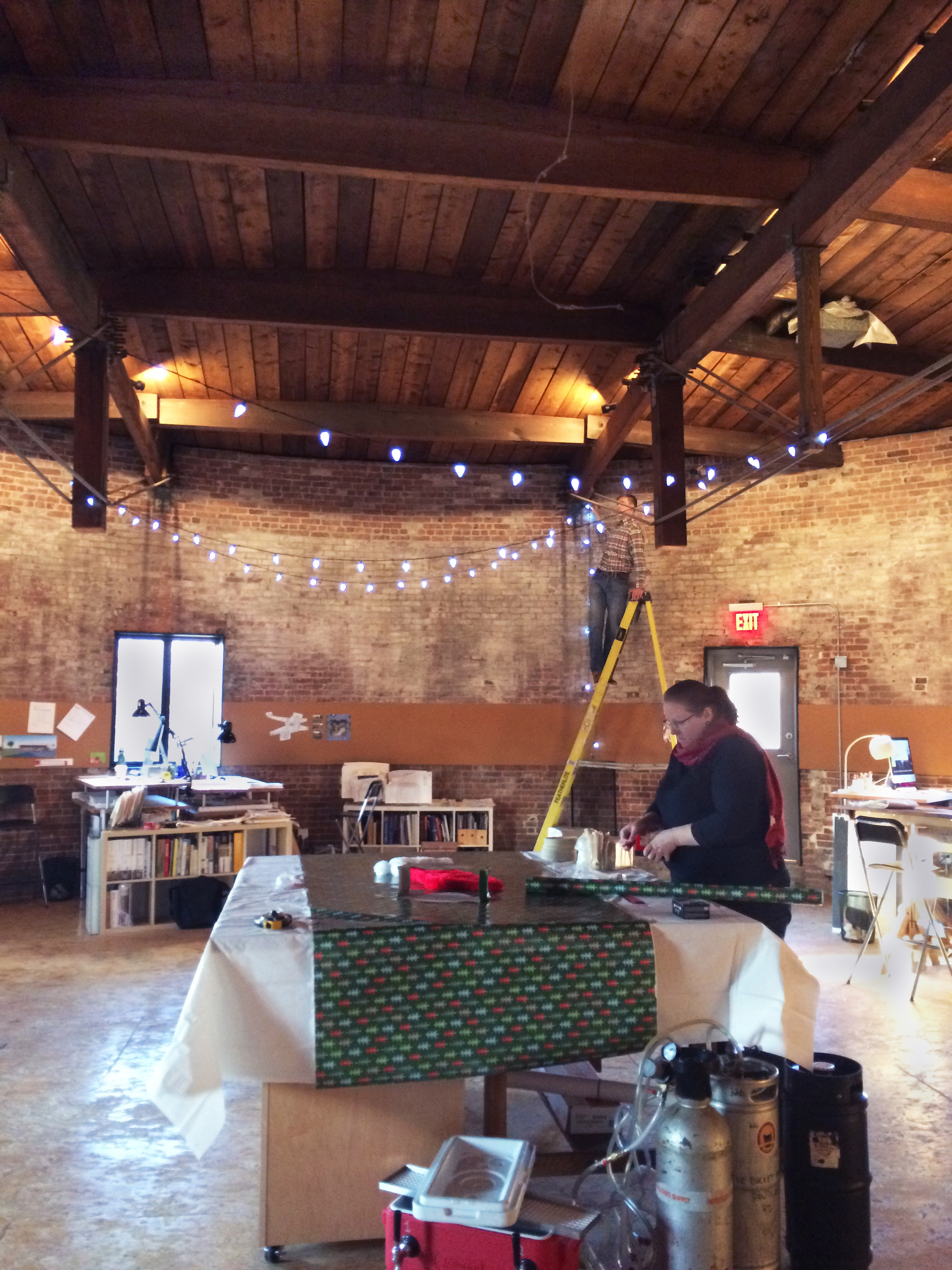 Party prep, Taylor hanging the lights and Kathy setting up the feast (note elaborate beer keg) 