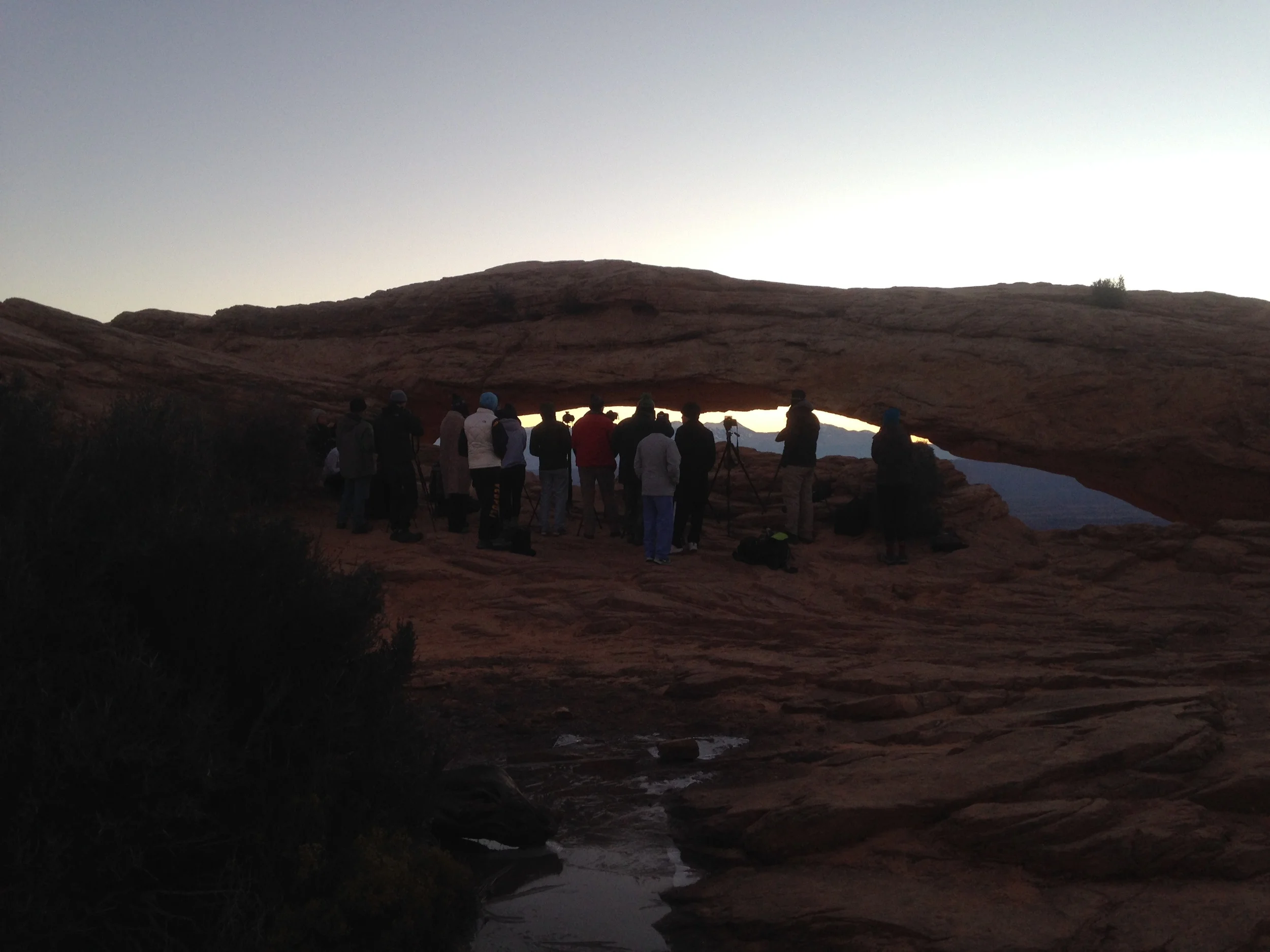 Photographers Shoulder to Shoulder at Mesa Arch Sunrise