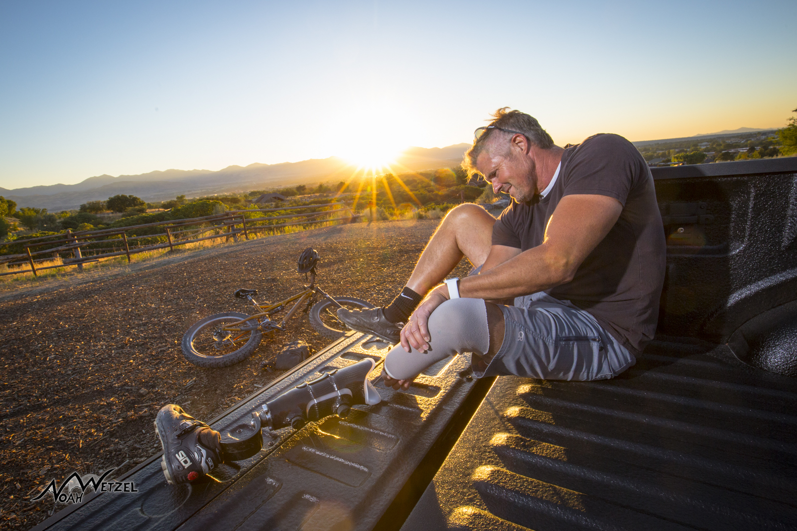 Kevin Mayberry using the Revo-fit Lanyard. Two Strobes. One lighting up bike, the other located above Kevin's right shoulder.