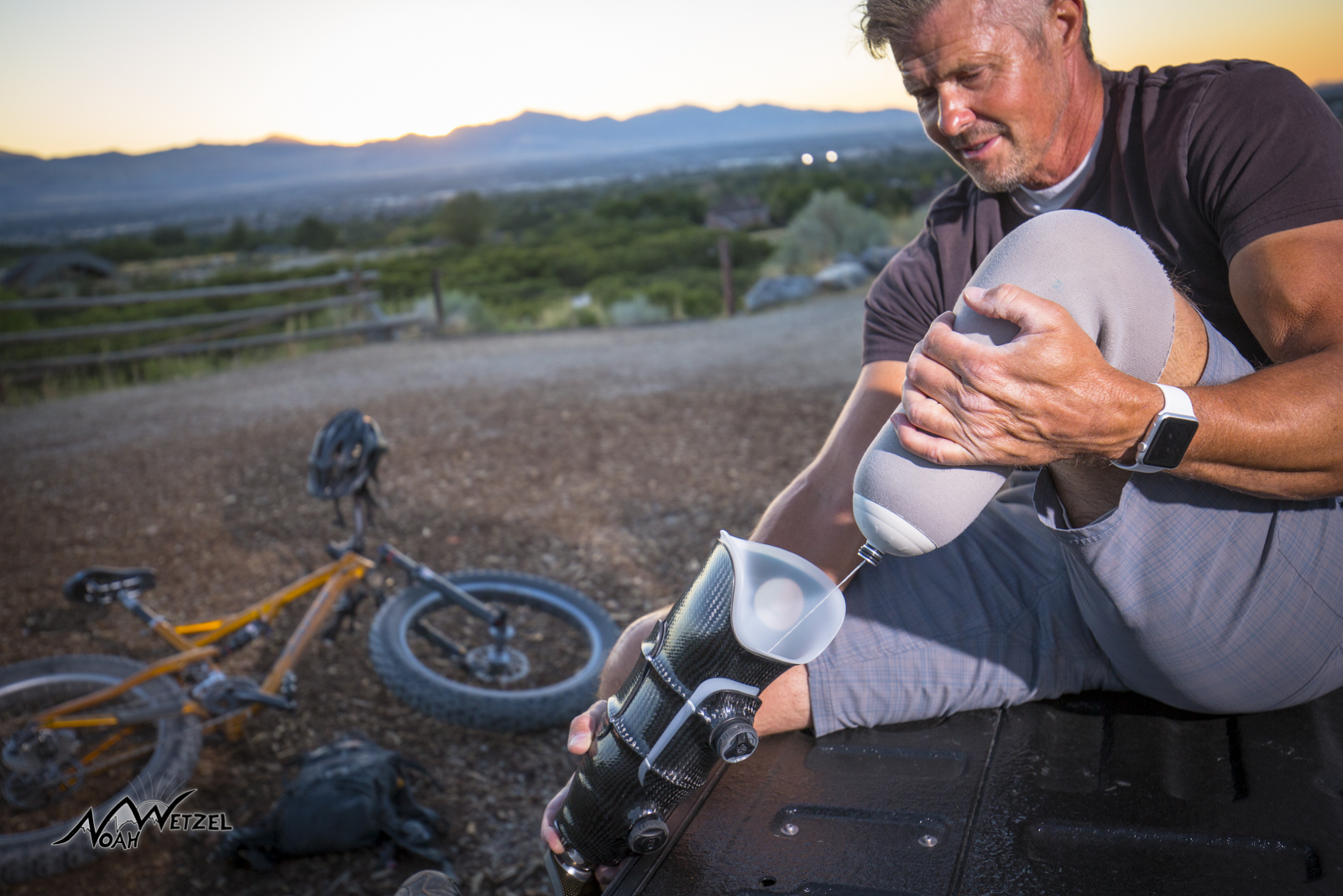 Kevin Mayberry. Revo-fit Lanyard. Two strobes at Sunset. One to the left lighting up bike, one to the right and above him lighting up Kevin and his socket.