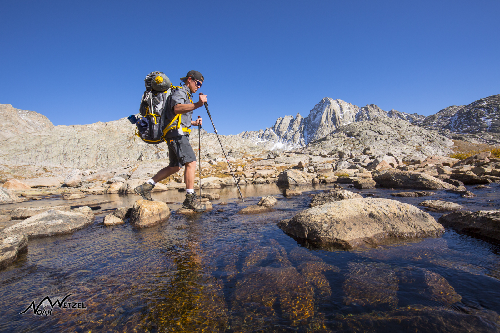 Ben Wetzel crossing a small stream at Indian Basin in the Wind River Range. Wyoming